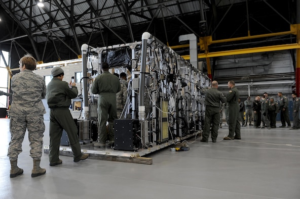Members of the 375th and 932nd Aeromedical Evacuation Squadrons look through the new Transport Isolation System Jan. 26, 2015, at Scott Air Force Base, Illinois. Testing on the new system was conducted at Joint Base Charleston, South Carolina, as well as a five day training course for two teams from Charleston and the 375th AES. (U.S. Air Force photo/Staff Sgt. Jonathan Fowler)