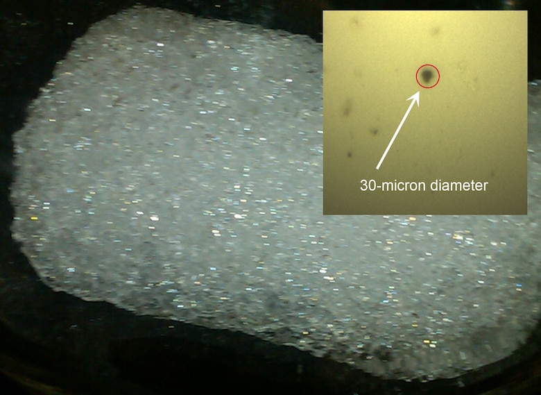 Researchers at CRREL are testing the use of LIBS for detecting paleo-climate proxy indicators in ice cores from Greenland Ice Summit.  The inset shows an individual dust particle in the sample.