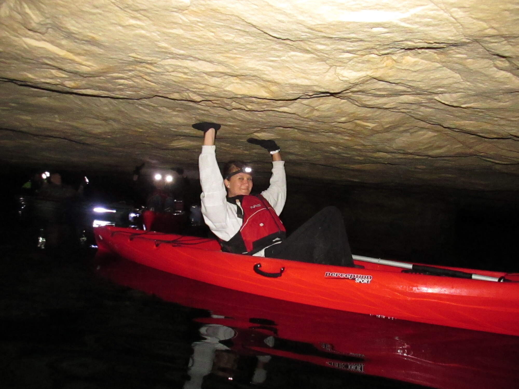 Airman 1st Class Megan Friedl makes her way through a tight squeeze while kayaking at Crystal City Underground in Crystal City, Missouri. Freidl was with a group from Scott Air Force Base, Illinois, taking part in a Single Airman's Initiative trip hosted by the 375th Force Support Squadron Outdoor Adventure Program. (Courtesy photo/Garry Green)