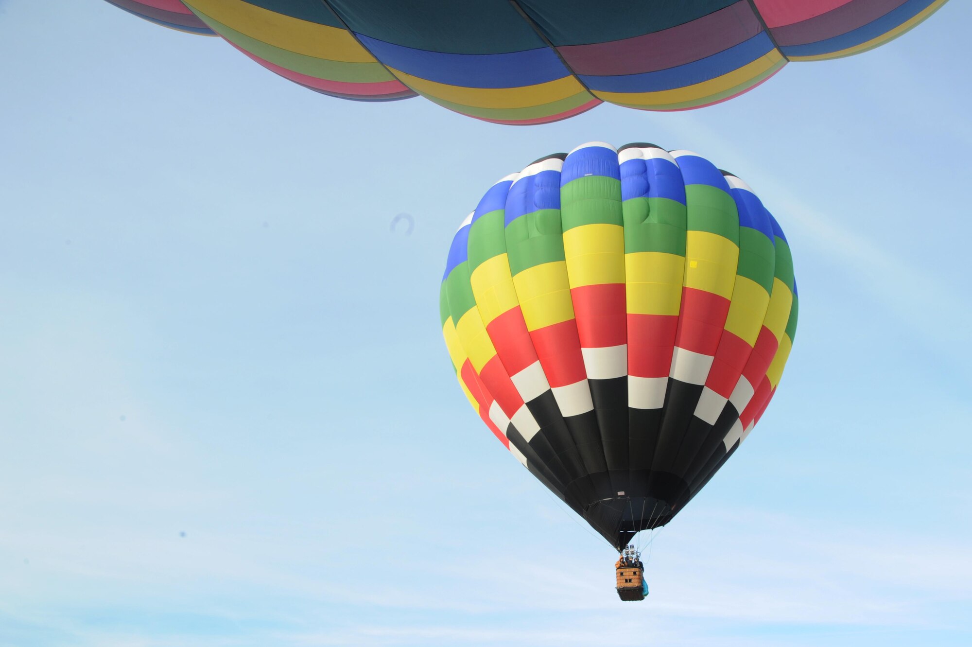 A group of Airmen stand in a hot air balloon up in the sky in High Ridge, Mo. Nov. 24. The Airmen reached up to heights of 2,400 feet while they were in a hot air balloon. (U.S. Air Force photo/Airman Megan Friedl)