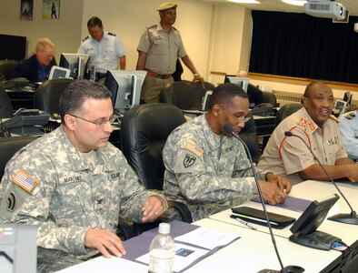 Col. Dave Martinez (left), director of Joint Operations; Brig. Gen. Renwick Payne, director of Joint Staff for the New York National Guard; and Gen. Godfrey Ngwenya, chief of the South African Defence Force; are briefed on New York National Guard capabilities and organization during Ngwenya's visit the New York State Division of Military and Naval Affairs headquarters on Monday, May 17. South Africa is paired with New York as part of the National Guard's State Partnership Program in which state National Guards develop bilateral relationships with developing nation's militaries.