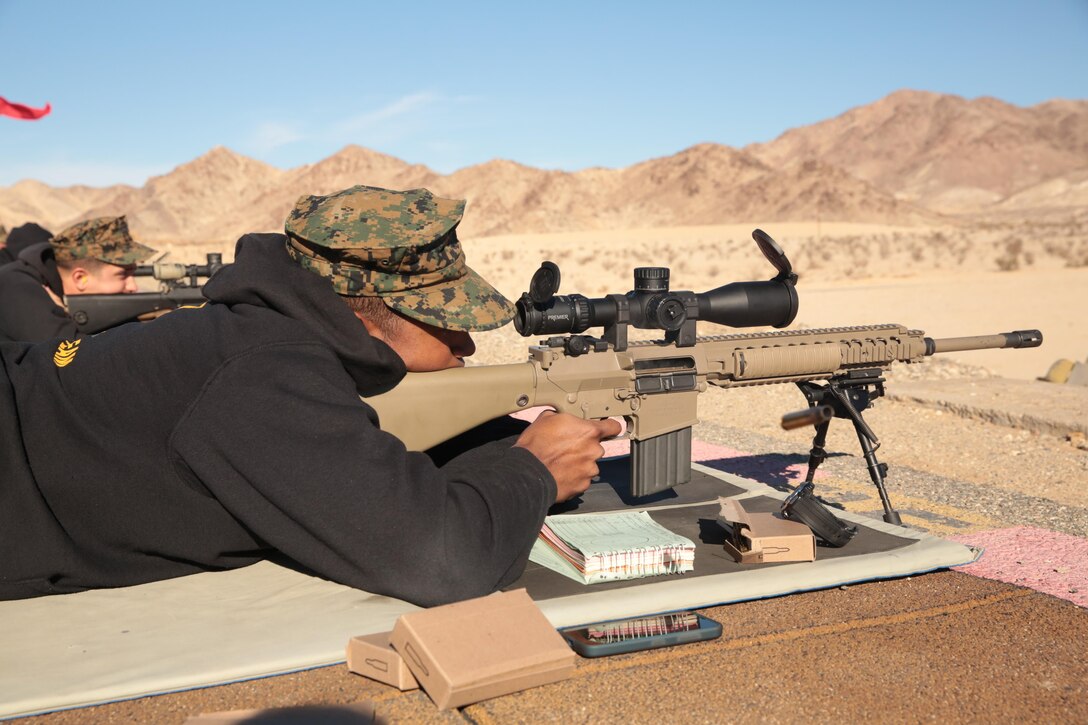 Lance Cpl. Egber Piza, takes his shot during the Combat Center DieSeL Classic at the base Qualification Range, Jan. 17, 2015. The competition is split up into individual and team matches. (Official Marine Corps photo by Lance Cpl. Medina Ayala-Lo/Released)