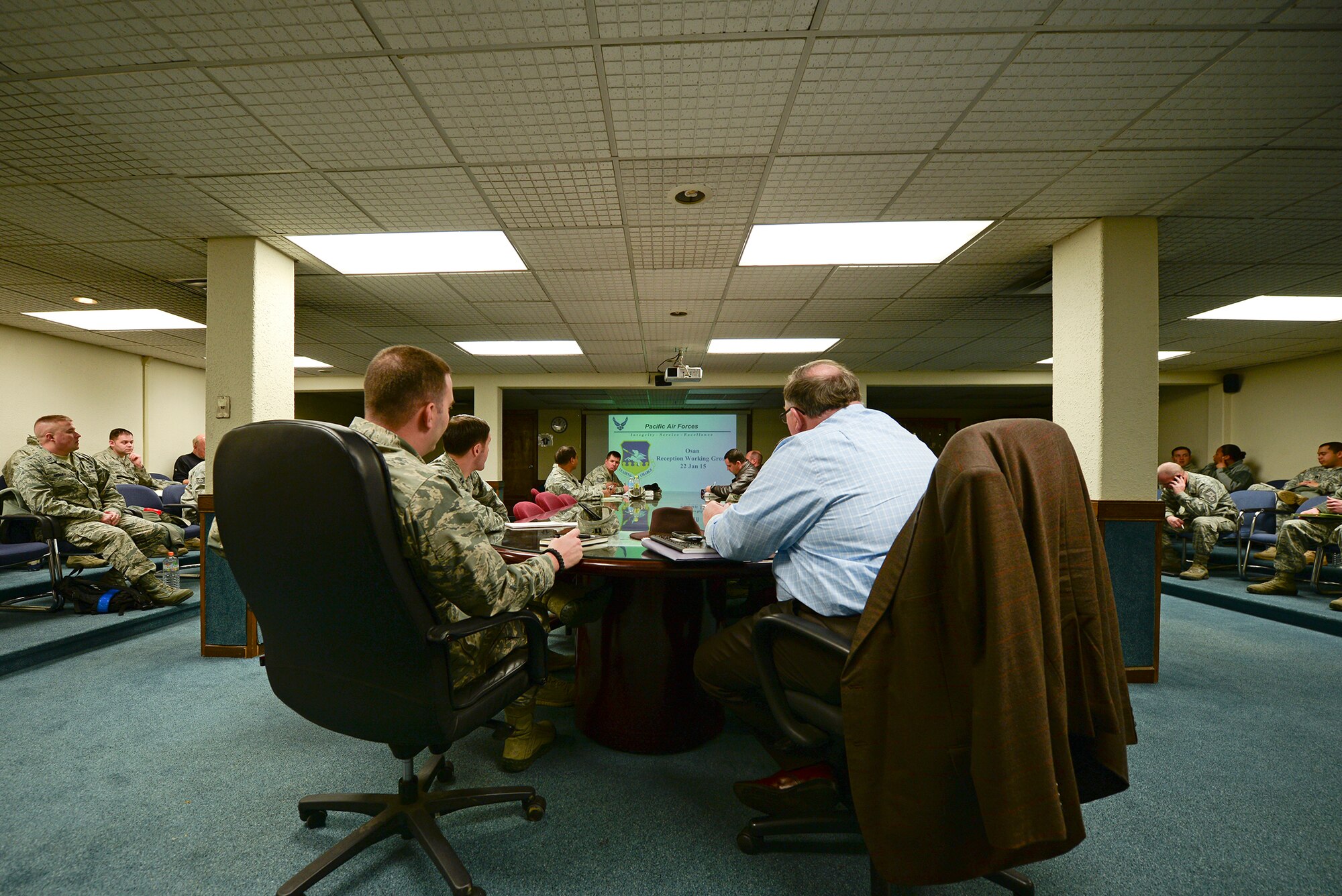 Team Osan's Reception Working Group meets to discuss incoming personnel Jan. 22, 2015, at Osan Air Base, Republic of Korea. The 51st Force Support Squadron beddown team is part of the group, ensuring there is appropriate space on base to house incoming or transient troops (U.S. Air Force photo by Staff Sgt. Jake Barreiro)