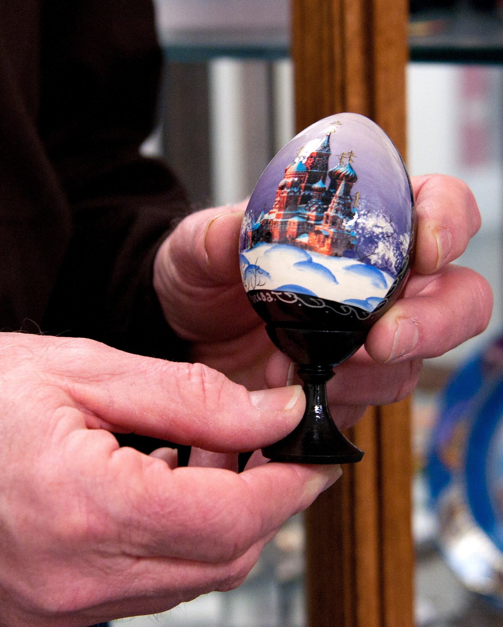 Rex Ellis, 90th Missile Wing treaty compliance office chief, showcases one of the many Russian souvenirs Jan. 26, 2014, which he has received while working on F.E Warren Air Force Base, Wyo. The items the treaty office receives while working with foreign nationals are on display outside of the treaty office. (U.S. Air Force photo by Airman 1st Class Malcolm Mayfield)