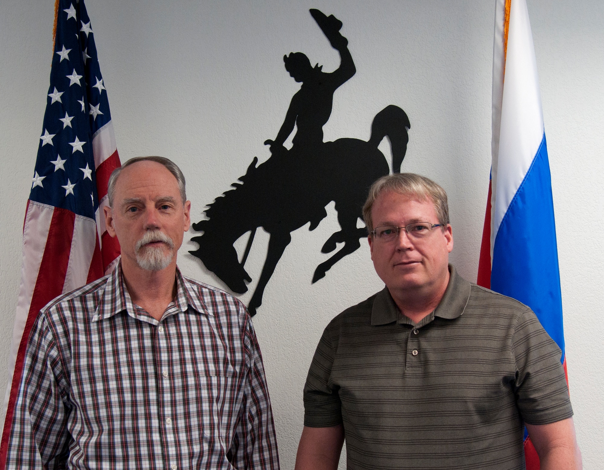 Rex Ellis and Roger Jacobsen, 90th Missile Wing treaty compliance office, pose in the treaty conference room Jan. 28, 2014. The treaty office manages the treaties that affect F.E. Warren Air Force Base, Wyo. (U.S. Air Force photo by Airman 1st Class Malcolm Mayfield)