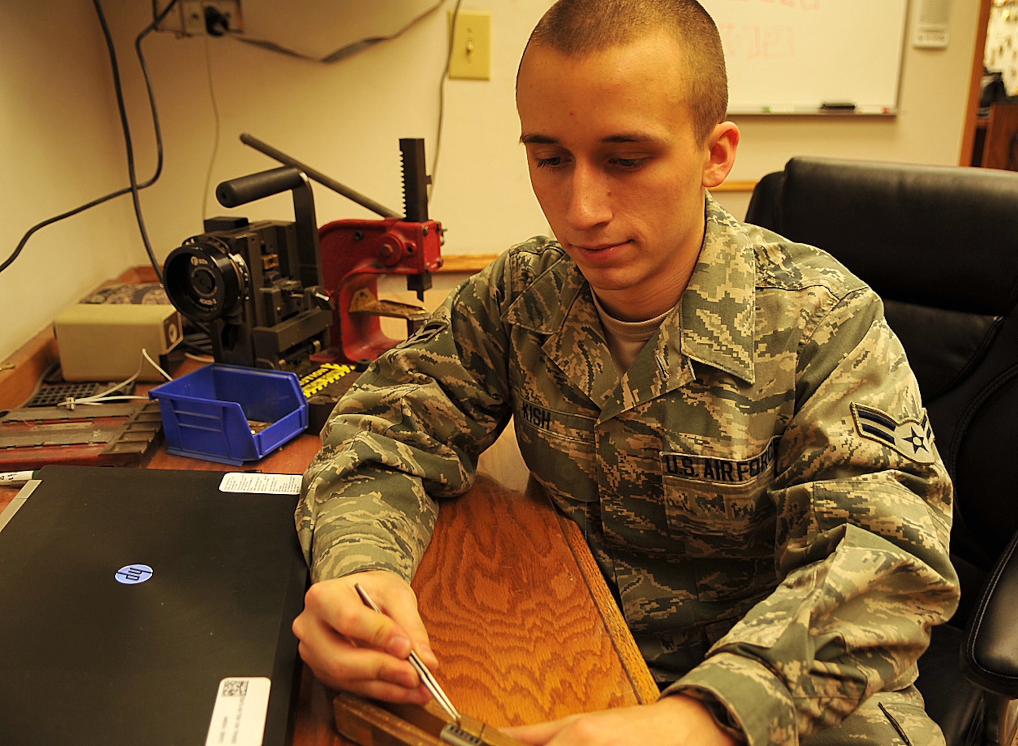 Airman 1st Class Jason Kish, 319th Civil Engineer Squadron structural apprentice, practices placing pins in a barrel used to build a lock Jan. 27, 2015 at Grand Forks Air Force Base, N.D. As a structural apprentice, Kish specializes in building, fixing and picking locks. Kish was selected as Warrior of the Week for the last week in January. (U.S. Air Force photo/Airman 1st Class Bonnie Grantham)