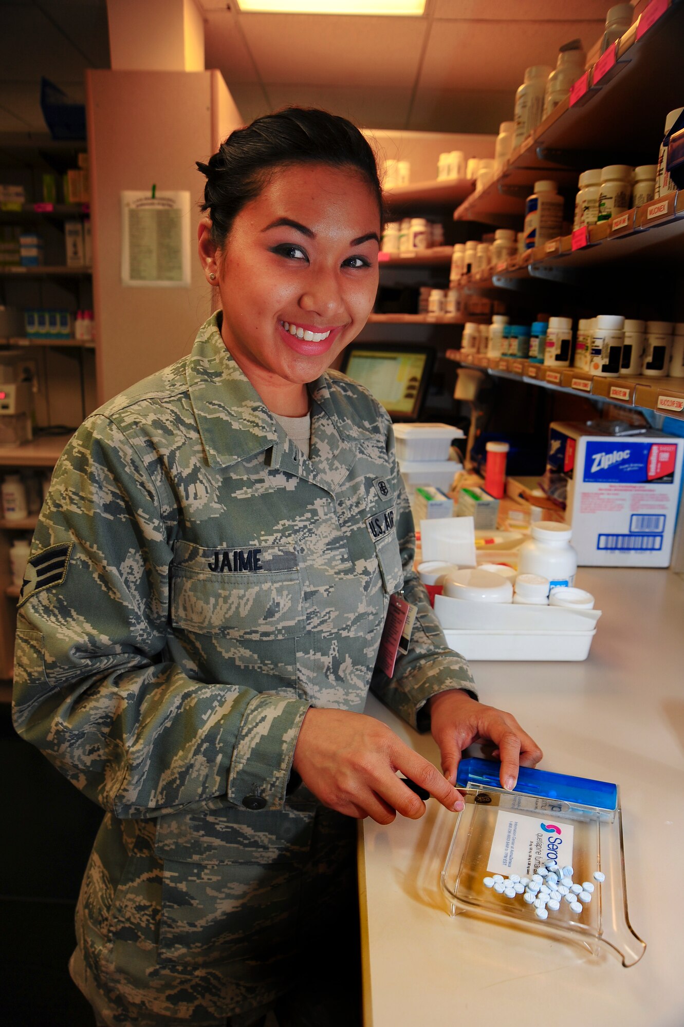 U.S. Air Force Senior Airman Alexa Jane Jaime, 355th Medical Support Squadron pharmacy technician, counts pills for a prescription at Davis-Monthan Air Force Base, Ariz., Jan. 28, 2015.  The 355th Medical Group is celebrating the 50th anniversary of the Biomedical Sciences Corps this week.  (U.S. Air Force photo by Staff Sgt. Angela Ruiz)