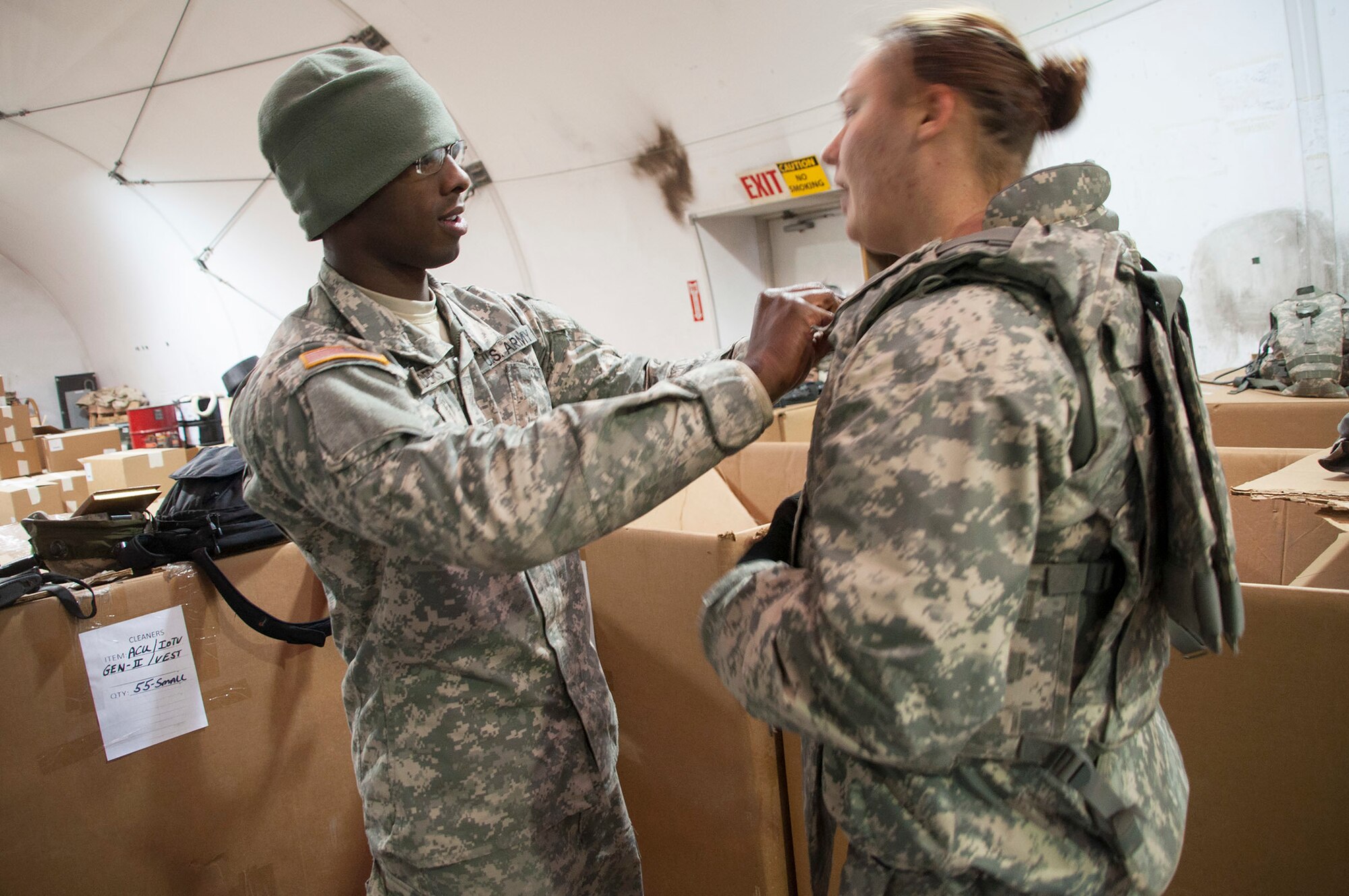 Spc. Brandon Zanders, 321st Sustainment Brigade supply specialist, from Baton Rouge, La., inspects an improved outer tactical vests before issuing it to a Soldier participating in WAREX at Joint Base McGuire-Dix-Lakehurst, N.J. (Photo by Sgt. Ferdinand Thomas/Released)