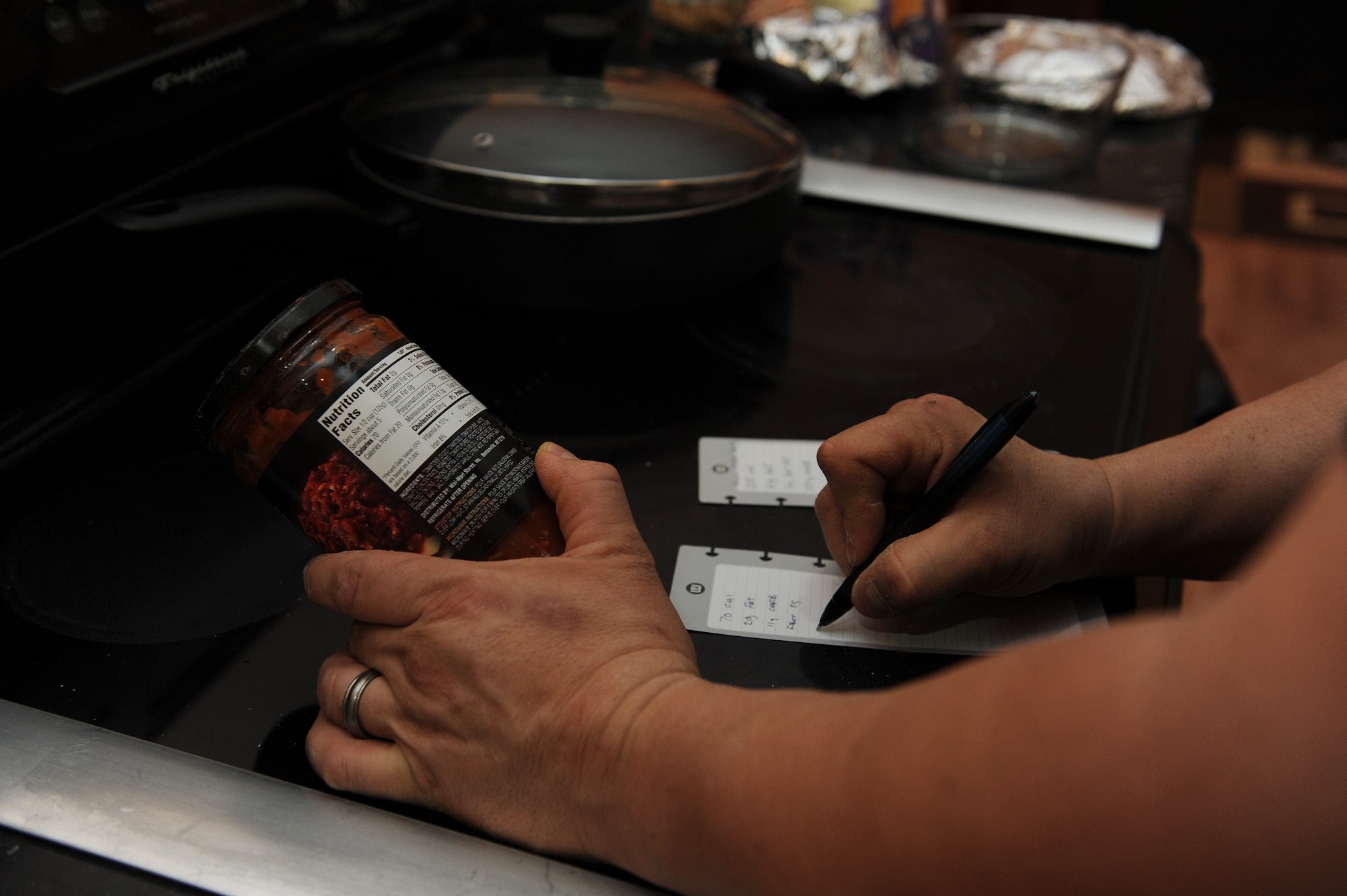 Master Sgt. Scott Stuehrenberg calculates how many calories are going to be his dinner.  “It’s important to count calories and know how much you’re eating.”  Stuehrenberg is a 618th Air and Space Operations global operations manager.  (U.S. Air Force photo by Staff Sgt. Maria Bowman)