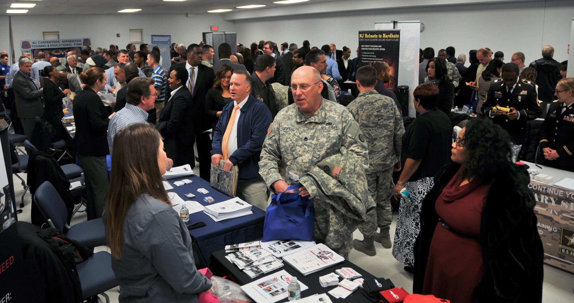 Several hundred service members, veterans and military spouses attend the Hiring Our Heroes job fair Jan. 21 at the Timmermann Conference Center at Joint Base McGuire-Dix-Lakehurst, N.J. The Army Reserve was a key partner in the event, which featured more than 80 employers, schools and service providers, who offered employment and education opportunities to attendees. (U.S. Army photo by Staff Sgt. Shawn Morris/Released)