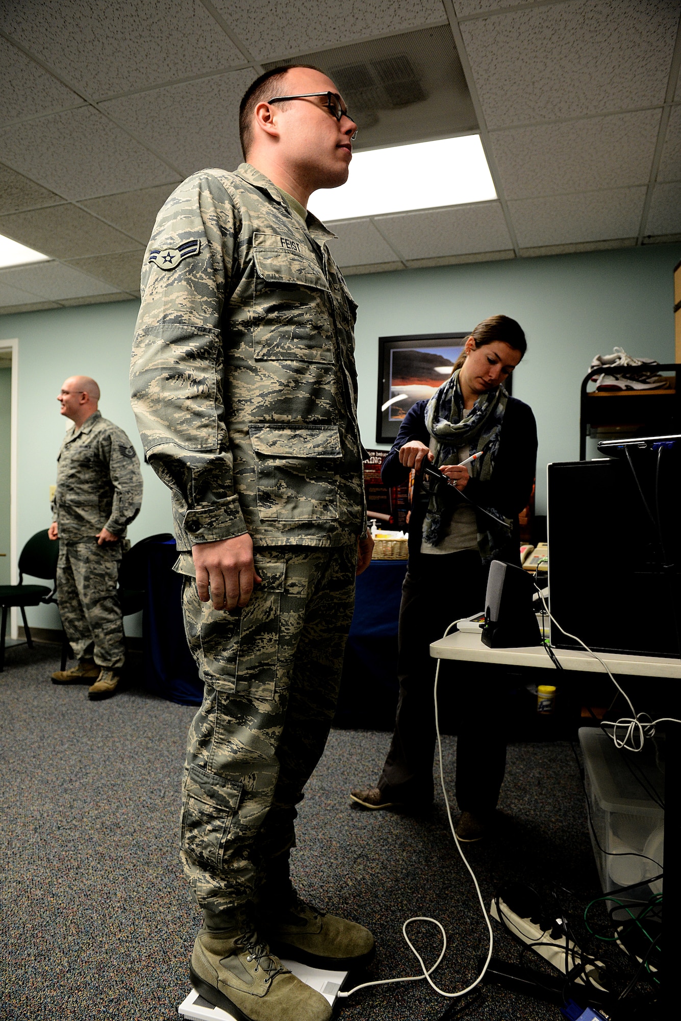 Airman 1st Class Matthew Feist, 375th Communications Support Squadron Computer Systems Programmer, weighs in for the Biggest Loser 8 Week Challenge Jan. 23, 2015, at the Scott Air Force Base Fitness Center. A prize will be awarded to the team that has the highest percentage of weight loss as a team and as an individual. (U.S. Air Force photo/Senior Airman Jake Eckhardt)