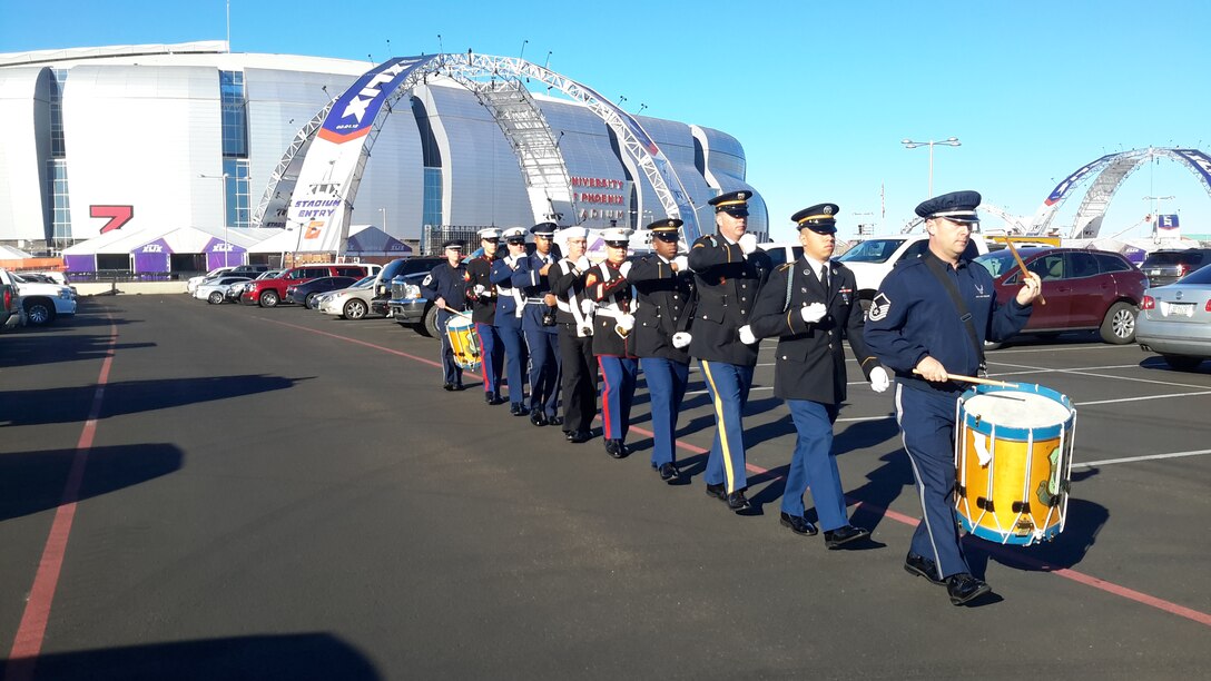 Senior Master Sgt. Chris Martin and Master Sgt. Tom Rarick rehearse with a Joint Service Honor Guard outside of the University of Phoenix Stadium. The group later performed for the opening ceremony at the Pro Bowl during the national anthem, January 25th. (U.S. Air Force Photo)