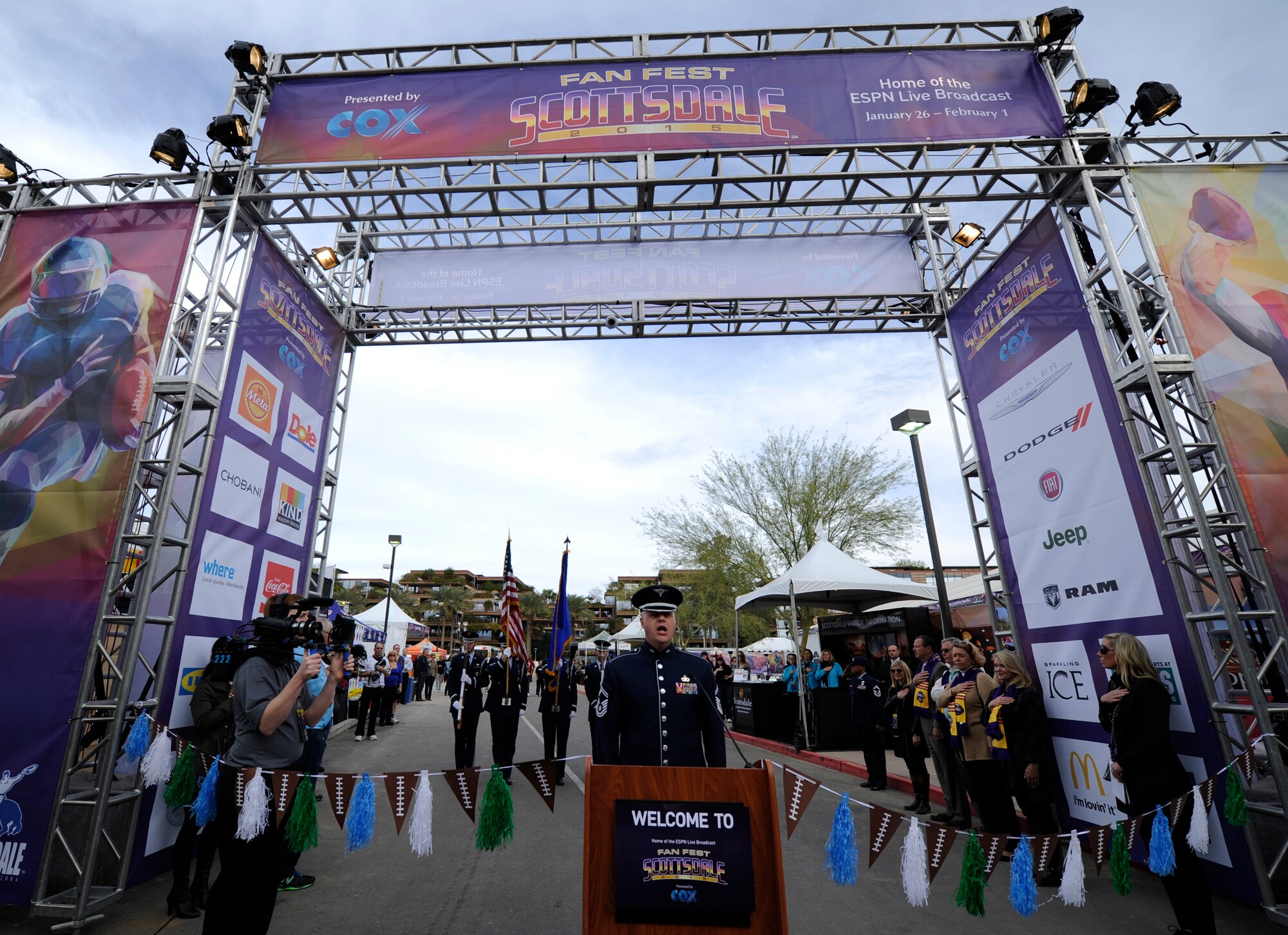 Senior Master Sgt. Ryan L. Carson, U.S. Air Force Band Max Impact vocalist, sings the National Anthem during a ribbon cutting ceremony at Fan Fest in Scottsdale, Ariz., Jan. 26, 2015. The band’s mission is to honor those who have served, inspire American citizens to heighten patriotism and services, and positively impact the global community on behalf of the USAF and United States of America. (U.S. Air Force photo by Senior Airman Nesha Humes)