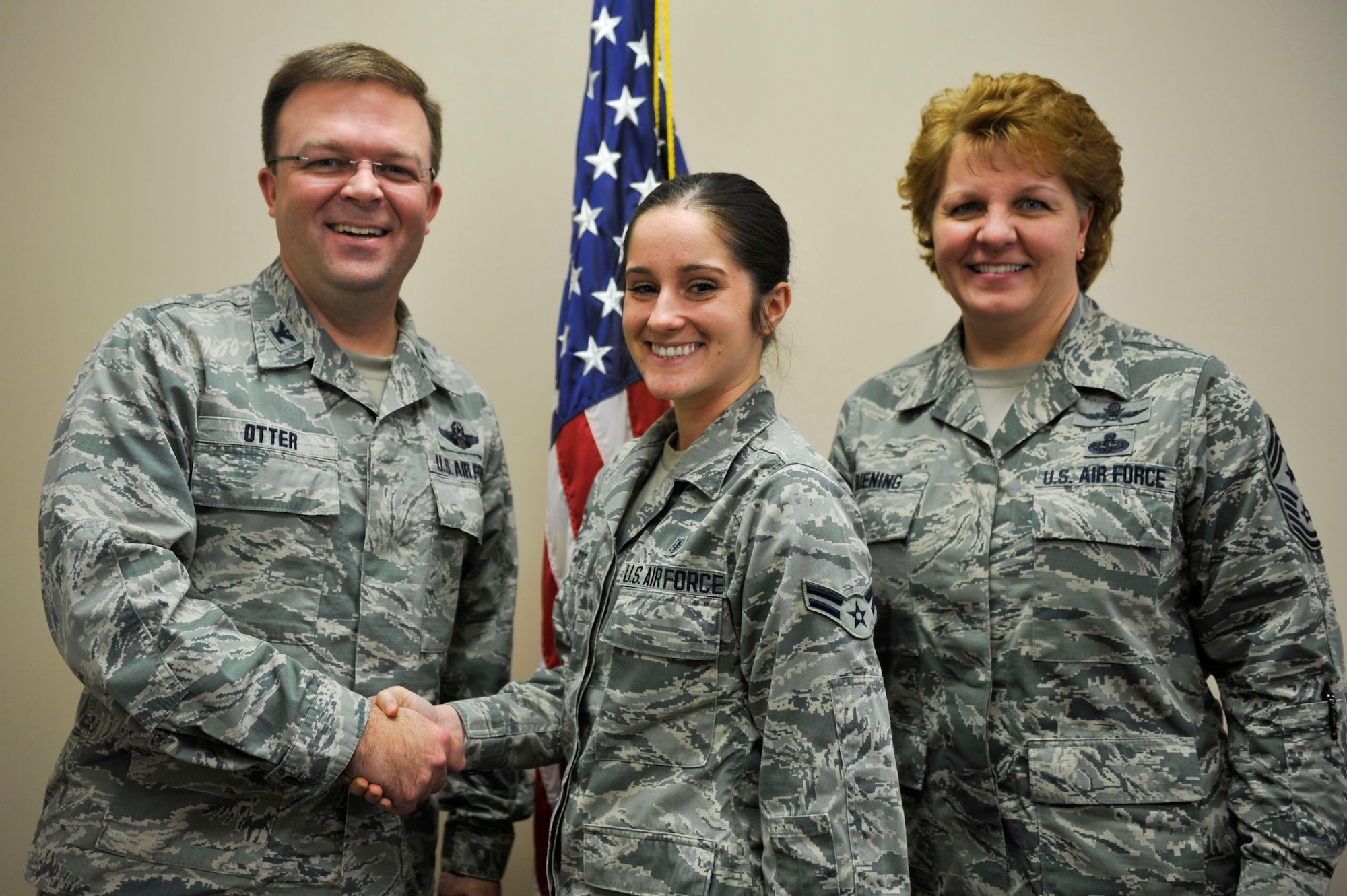 Col. William Otter, the 19th Airlift Wing vice commander, along with Chief Master Sgt. Rhonda Buening, the 19th AW command chief, congratulate Airman 1st Class Josephine Dispoto, a 19th Medical Operations Squadron mental health technician, for her selection as Combat Airlifter of the Week Jan 26 at Little Rock Air Force Base. Dispoto is the primary facilitator for Little Rock AFB’s automated neuropsychological assessment metrics. The ANAM test is a mandatory pre-deployment neuropsychological assessment that establishes a baseline that will be used if the service member is affected with a brain injury downrange.  (U.S. Air Force photo by Senior Airman Regina Edwards)