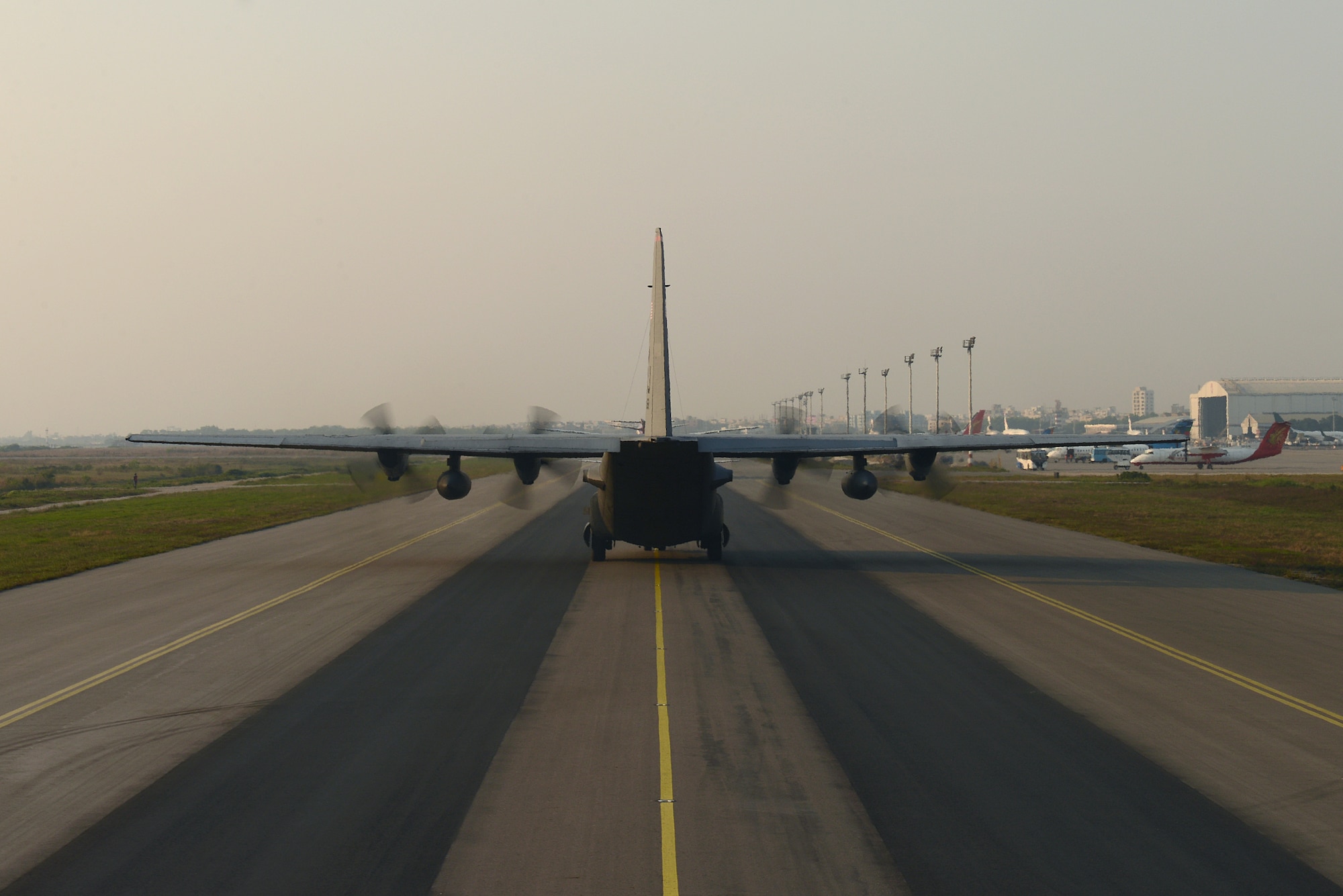 A C-130H aircraft assigned from the 374th Airlift Wing, Yokota Air Base, Japan, taxis a runway at BAF Base Bangabandhu during Exercise COPE SOUTH, Jan. 25, 2015. COPE SOUTH is a Pacific Air Forces-sponsored, bilateral tactical airlift exercise conducted in Bangladesh, with a focus on cooperative flight operations, day and night low-level navigation, tactical airdrop, and air-land missions as well as subject-matter expert exchanges in the fields of operations, maintenance and rigging disciplines. (U.S. Air Force photo by 1st Lt. Jake Bailey/Released)