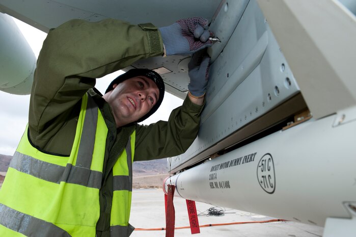 Royal Air Force Cpl Lee Sorman, a weapons technician assigned to the 6 Squadron, RAF Lossiemouth, Scotland, conducts armament inspections beneath a Typhoon FGR4 fighter at Nellis Air Force Base, Nev., Jan. 27, 2015. 6 Sqn joins numerous other U.S. and coalition units in Red Flag 15-1, the latest iteration of the 414th Combat Training Squadron’s advanced air, space and cyberspace exercise. (U.S. Air Force photo by Airman 1st Class Joshua Kleinholz)