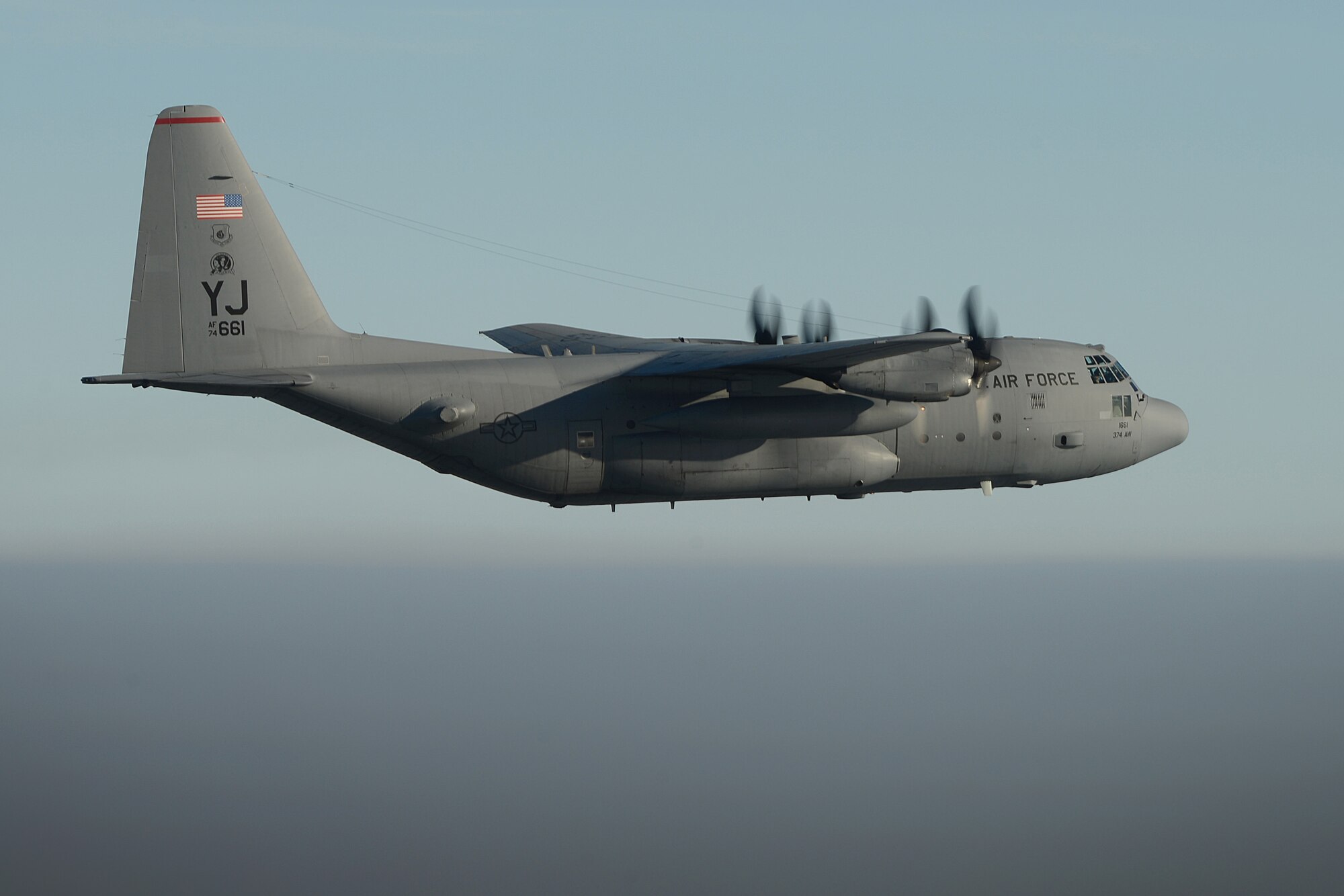 A C-130H aircraft assigned from the 374th Airlift Wing, Yokota Air Base, Japan, flies a mission in support of Exercise COPE SOUTH near Sylhet, Bangladesh, Jan. 25, 2015. COPE SOUTH is a Pacific Air Forces-sponsored, bilateral tactical airlift exercise conducted in Bangladesh, with a focus on cooperative flight operations, day and night low-level navigation, tactical airdrop, and air-land missions as well as subject-matter expert exchanges in the fields of operations, maintenance and rigging disciplines. (U.S. Air Force photo by 1st Lt. Jake Bailey/Released)