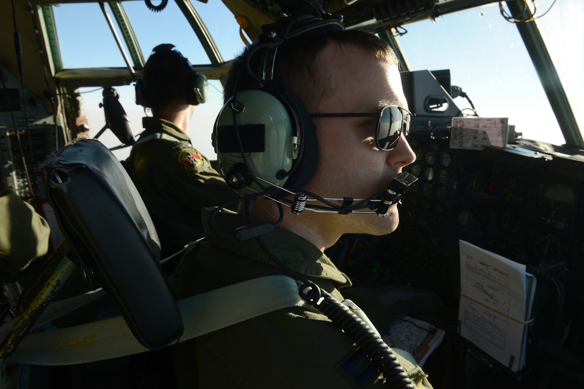 U.S. Air Force Capt. Jody Robertson, a C-130H aircraft pilot assigned to the 36th Airlift Squadron, Yokota Air Base, Japan, scans the horizon during a personnel drop mission supporting Exercise COPE SOUTH near Syhlet, Bangladesh, Jan. 25, 2015. COPE SOUTH helps cultivate common bonds, foster goodwill, and improve readiness and compatibility between members of the Bangladesh and U.S. Air Forces. (U.S. Air Force photo by 1st Lt. Jake Bailey/Released)