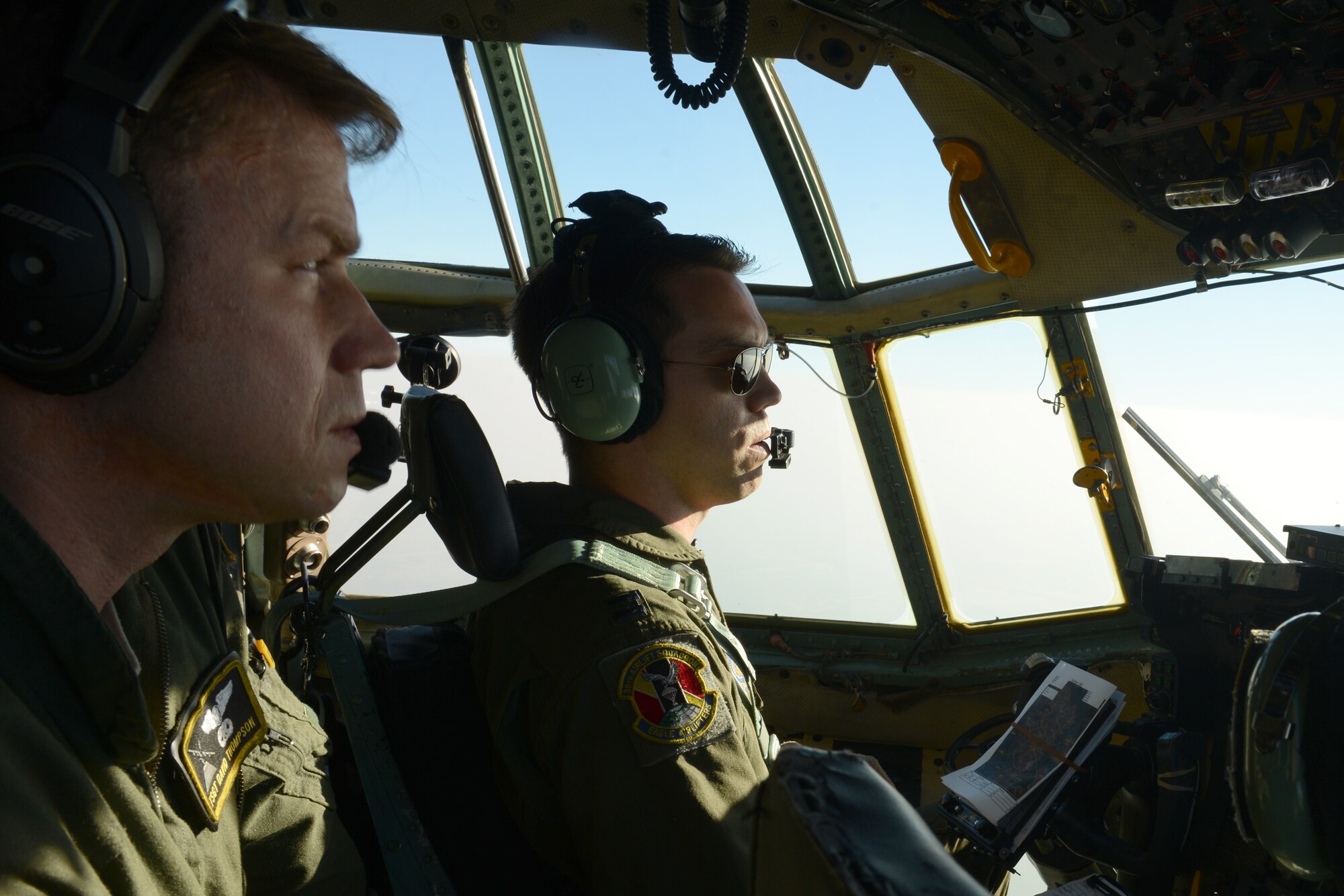 U.S. Air Force Capt. Travis Wilkes, right, and Tech. Sgt. David Thompson identify a drop zone during Exercise COPE SOUTH near Sylhet, Bangladesh, Jan. 25, 2015. Wilkes is a pilot assigned to the 36th Airlift Squadron, Yokota Air Base, Japan, and Thompson is a flight engineer also assigned to the 36th. COPE SOUTH is a Pacific Air Forces-sponsored, bilateral tactical airlift exercise conducted in Bangladesh, with a focus on cooperative flight operations, day and night low-level navigation, tactical airdrop, and air-land missions as well as subject-matter expert exchanges in the fields of operations, maintenance and rigging disciplines. (U.S. Air Force photo by 1st Lt. Jake Bailey/Released)