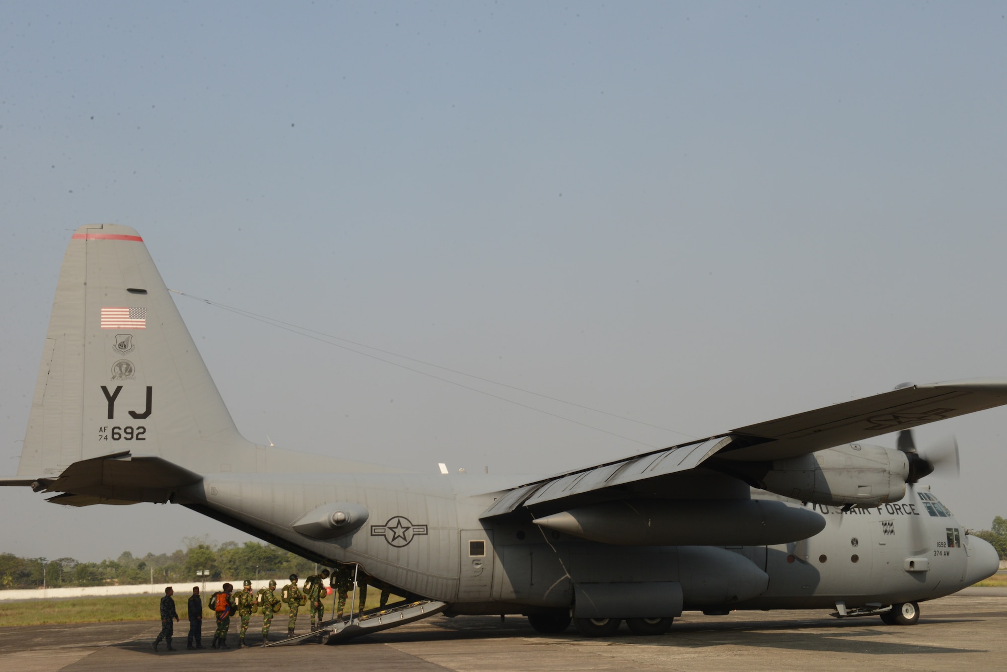 Bangladeshi paratroopers board a U.S. Air Force C-130H aircraft at Sylhet International Airport, Bangladesh, before conducting a personnel airdrop mission during Exercise COPE SOUTH, Jan. 25, 2015. COPE SOUTH helps cultivate common bonds, foster goodwill, and improve readiness and compatibility between members of the Bangladesh and U.S. Air Forces. (U.S. Air Force photo by 1st Lt. Jake Bailey/Released)