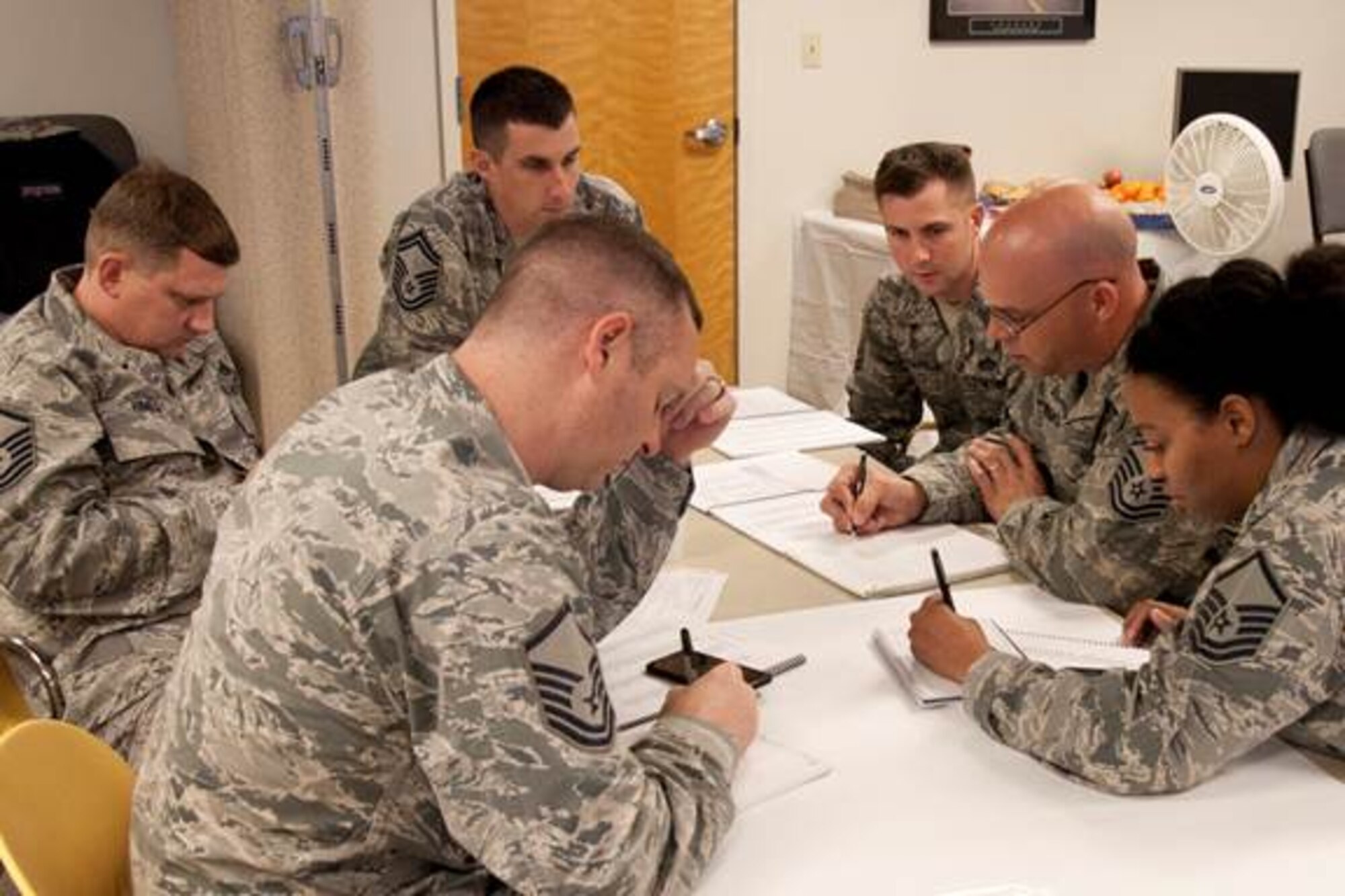 U.S. Air Force Airmen tackle one of the many practical exercises during the Senior Noncommissioned Leadership Course held at the 307th Bomb Wing, Barksdale Air Force Base, La., Jan. 25, 2015. Twenty-three Airmen attended the two-day course, which used interactive exercises to explore new ways to lead and influence people in the military. (U.S. Air Force photo by Master Sgt. Jeff Walston)