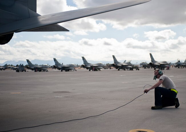 Airman 1st Class Samuel Kleekamp, a crew chief assigned to the 748th Aircraft Maintenance Squadron, Royal Air Force Lakenheath, England, inspects an F-15 Eagle prior to flight during Red Flag 15-1 at Nellis Air Force Base, Nev., Jan. 27, 2015. Crew chiefs are responsible for and dedicated to a single aircraft, and have their name stenciled on the aircraft along with the pilot’s. (U.S. Air Force photo by Staff Sgt. Siuta B. Ika)