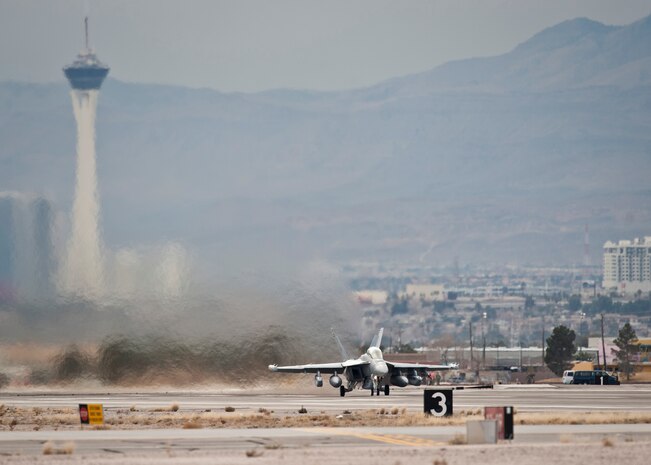 An EA-18G Growler assigned to Electronic Attack Squadron 132, Naval Air Station Whidbey Island, Wash., launches during Red Flag 15-1 at Nellis Air Force Base, Nev., Jan. 26, 2015. All four branches of the U.S. military participate in Red Flag exercises to familiarize participants with the other services for future operations. (U.S. Air Force photo by Staff Sgt. Siuta B. Ika)
