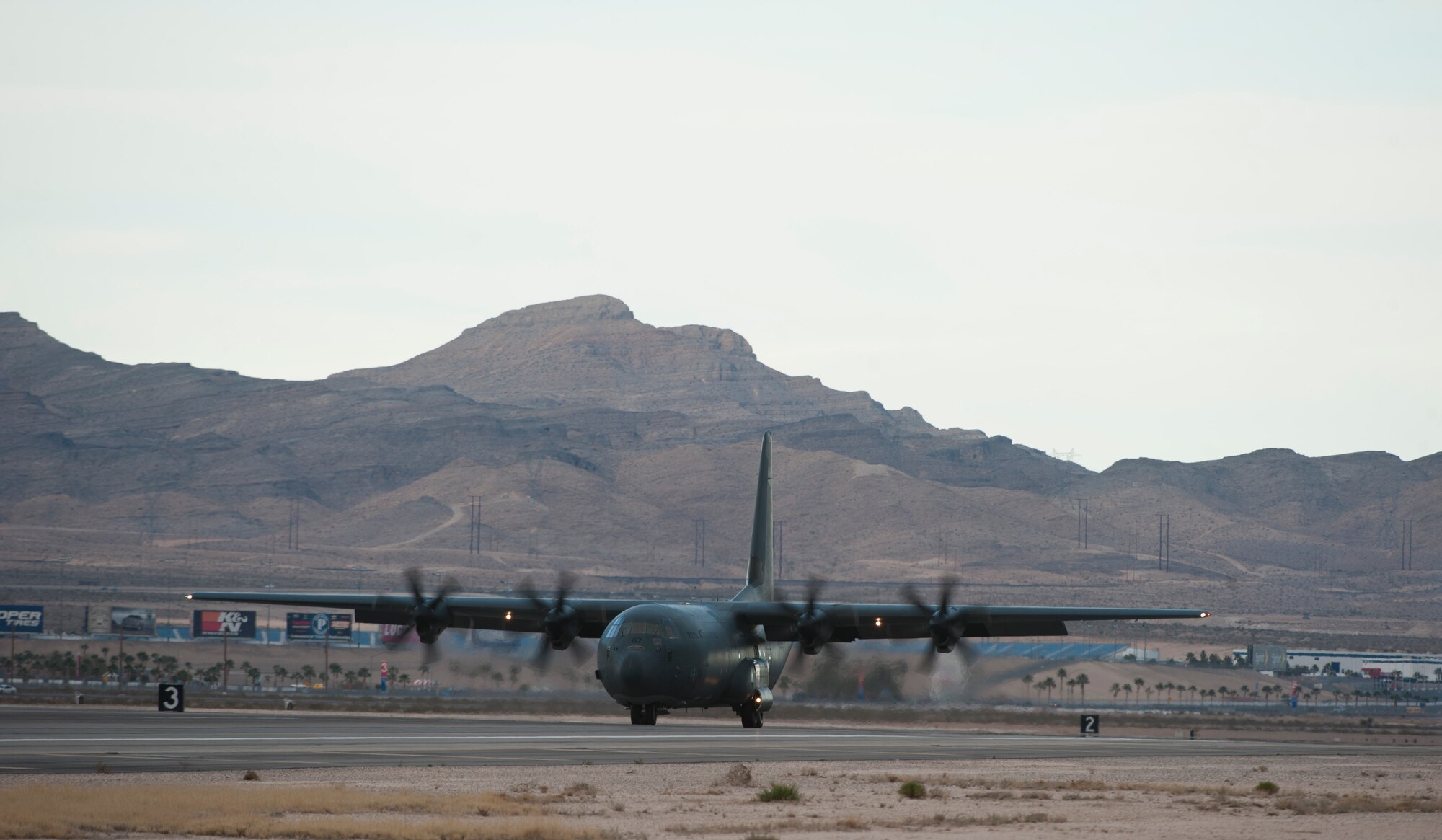 A Royal Australian air force C-130J Super Hercules from 37 Squadron, Richmond, Australia, lands during Red Flag 15-1 at Nellis Air Force Base, Nev., Jan 26, 2015. Red Flag provides a series of intense air-to-air scenarios for aircrew and ground personnel which will increase their combat readiness and effectiveness for future real world missions. (U.S. Air Force photo by Senior Airman Thomas Spangler)