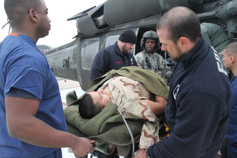 A simulated patient is medically evacuated by an HH-60 from 2nd Battalion, 1st Combat Aviation Brigade, 1st Infantry Division, to Fort Belvoir Community Hospital, Va., Jan. 21, 2015. (U.S. Army photo by Spc. Philip Scaringi/Released)