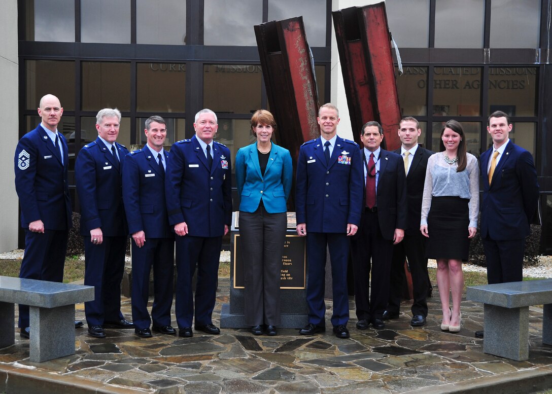 TYNDALL AIR FORCE BASE, Fla. - U.S. Rep. Gwen Graham of Florida, (center) is joined by senior leadership from the Continental U.S. Aersospace Defense Command Region – 1st Air Force (Air Forces Northern) organization along with the commander, 325th Fighter Wing and members of the congresswoman’s staff at the 9/11 Memorial following a tour of the 601st Air Operations Center Jan. 23. During her visit, the congresswoman not only toured both organizations, she also received mission briefings to learn more about daily operations. (U.S. Air Force photo by A1C Dustin Mullen/Released)