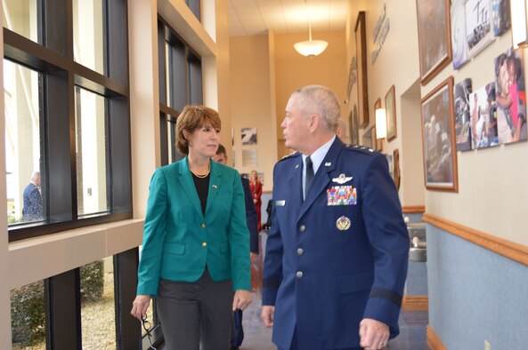 Lt. Gen. William Etter, Continental  U.S. Aerospace Defense Command Region – 1st Air Force (Air Forces Northern) Commander,  talks to U.S. Rep. Gwen Graham of Florida about the photos  (along the wall) at the 601st AOC during a visit by the congresswoman Jan. 23. Collectively, the photos depict the range of mission sets CONR-1st AF (AFNORTH) members can be involved with at any given time. (U.S. Air Force Photo by Mary McHale/Released)