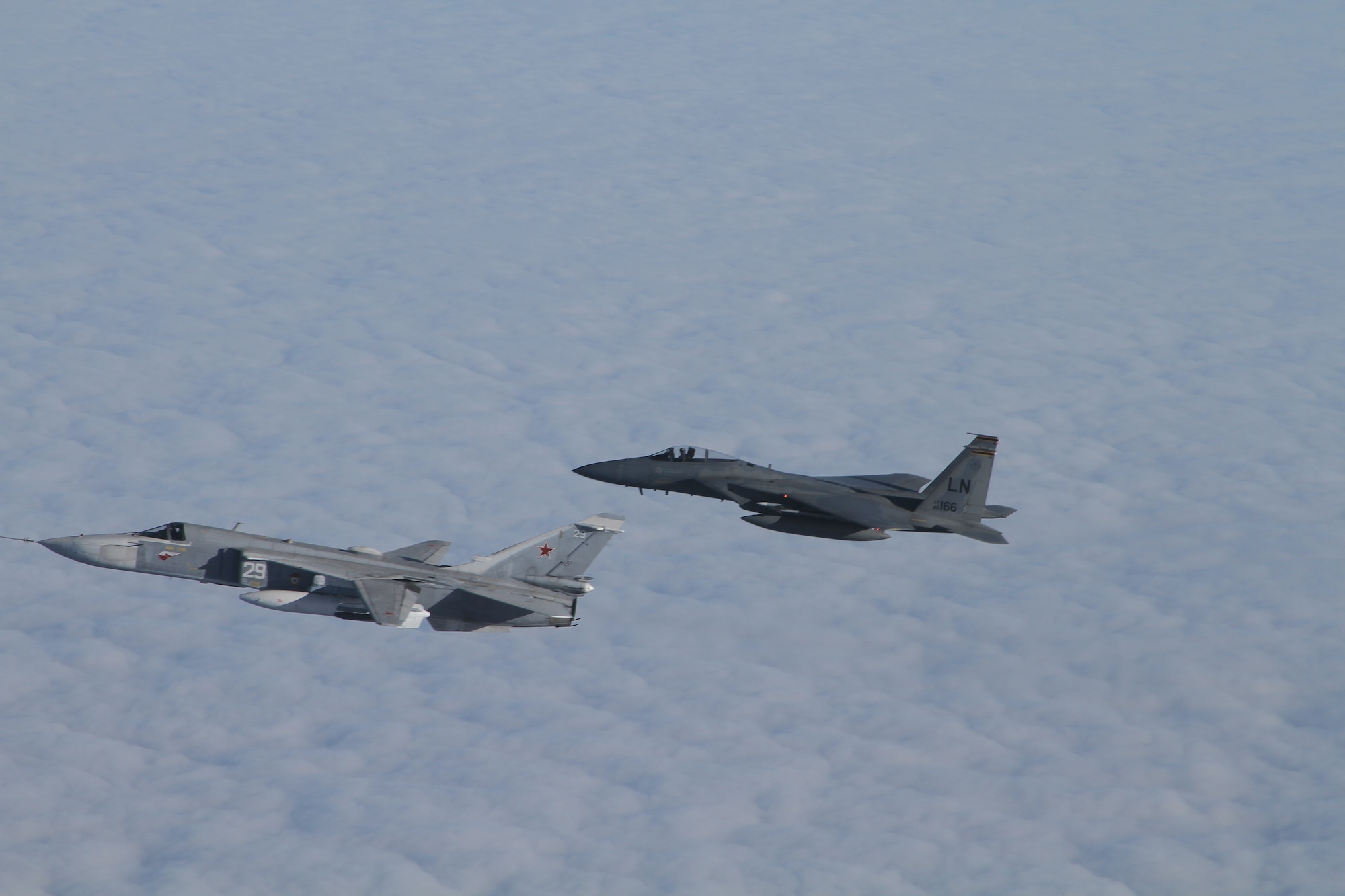 The 493rd Fighter Squadron F-15Cs intercept, identify and escort Russian Federation air force fighters during a NATO air police tasking. The squadron is assigned to Royal Air Force Lakenheath, England, and provides all-weather  air superiority and air-to-ground precision combat capability, day or night. (Courtesy Photo/Released)

