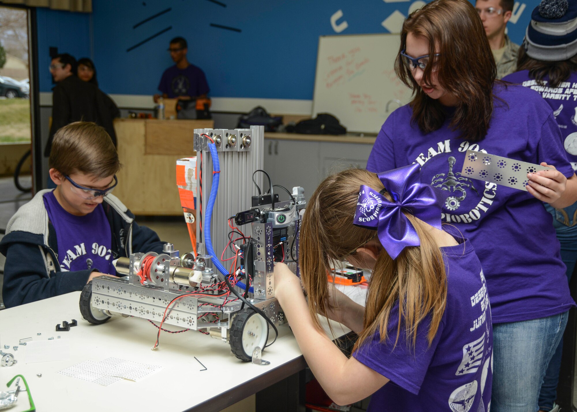 This year, both the junior varsity and varsity teams have a total of 28 students including females. Last year the Scorpion Robotics Team had only male students. The junior varsity team is coached by electrical engineer, Ana Franco. (U.S. Air Force photo by Rebecca Amber)