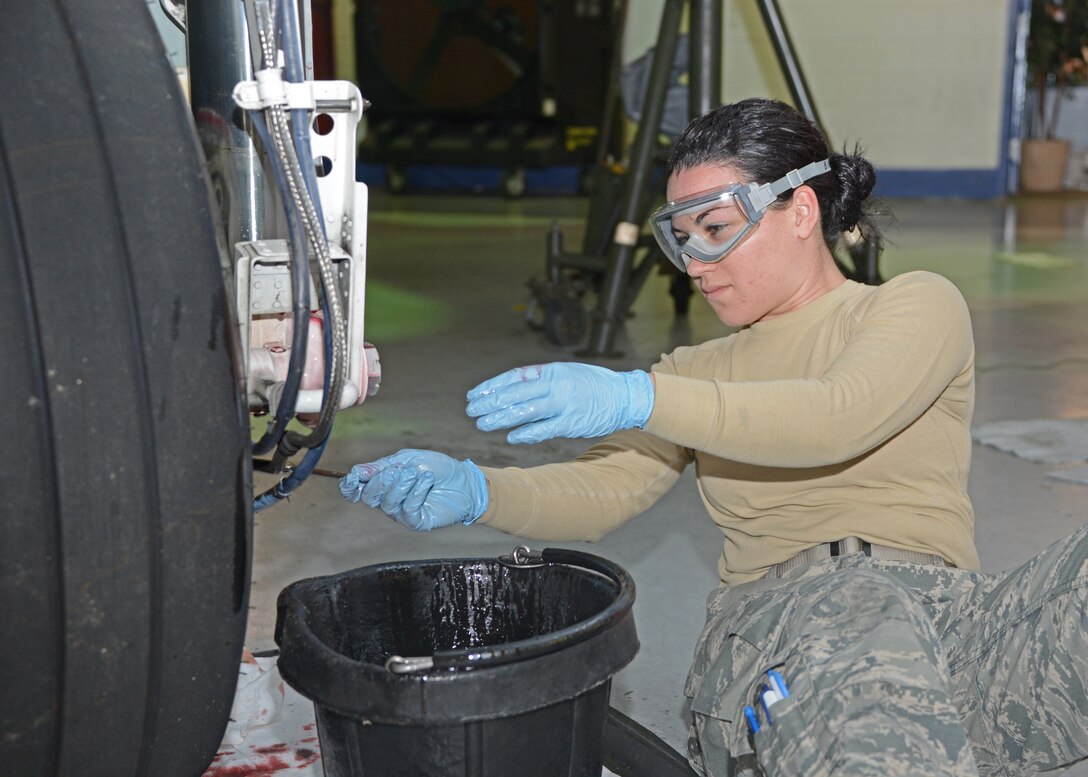 Senior Airman Barbara Rodriguez, A-10 pneudraulics specialist assigned to the 175th Aircraft Maintenance Squadron, Maryland Air National Guard, performs main landing gear initial strut servicing on an A-10C Thunderbolt II aircraft at Warfield Air National Guard Base, Baltimore, Md., on January 28, 2015. Rodriguez is the Maryland Air National Guard January Spotlight Airman. (Air National Guard photo by Tech. Sgt. Christopher Schepers)