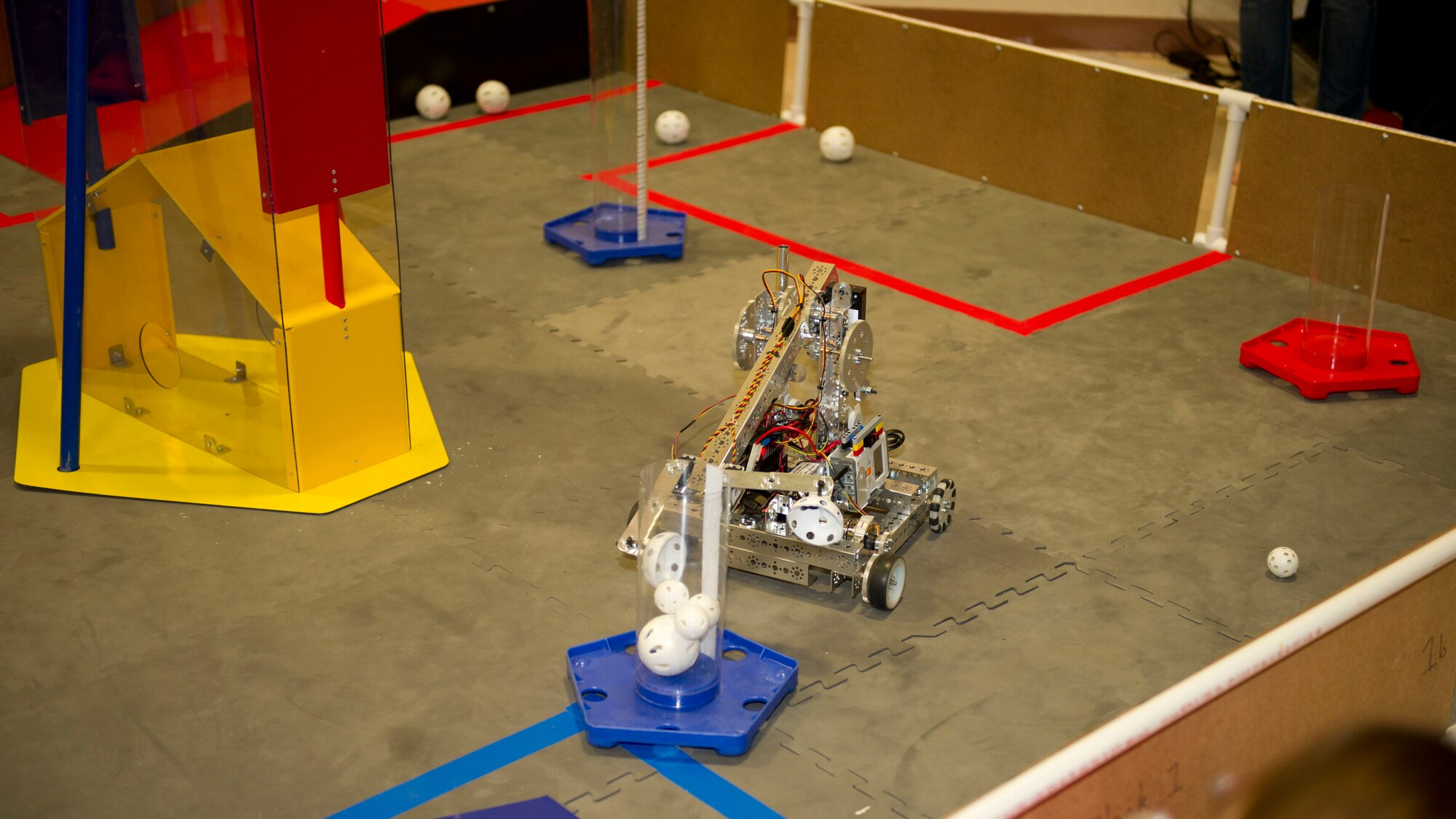 One of the Lego League’s teams demonstrates the abilities of their robot at the Otero County STEM preliminary round to the FIRST Lego League competition at the Tays Center in Alamogordo, N.M., Jan. 24, 2015. In each league competition, the children are graded and evaluated on their presentations, building of a robot, the capabilities of the robot, and the league’s core values. These values include teamwork, learning together, honor the spirit of friendly competition, learning is more important than winning, sharing experiences, and most of all having fun. (U.S. Air Force photo by Staff Sgt. E’Lysia A. Wray/Released)