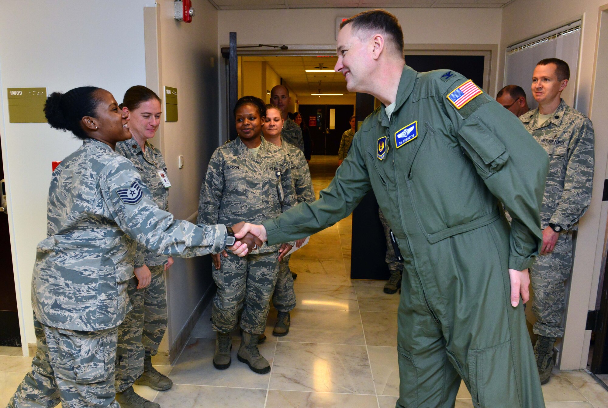 Tech. Sgt. Winifred Gordon, 39th Medical Operations Squadron surgical services flight chief, greets, Col. Timothy Robinette, U. S. Air Forces in Europe and Air Forces Africa command surgeon, during a one-day 39th Medical Group visit Jan. 22, 2015, at Incirlik Air Base, Turkey. As command surgeon, Robinette advises and represents the USAFE-AFAFRICA commander on all aspects of the medical service mission. (U.S. Air Force photo by Senior Airman Michael Battles/Released) 