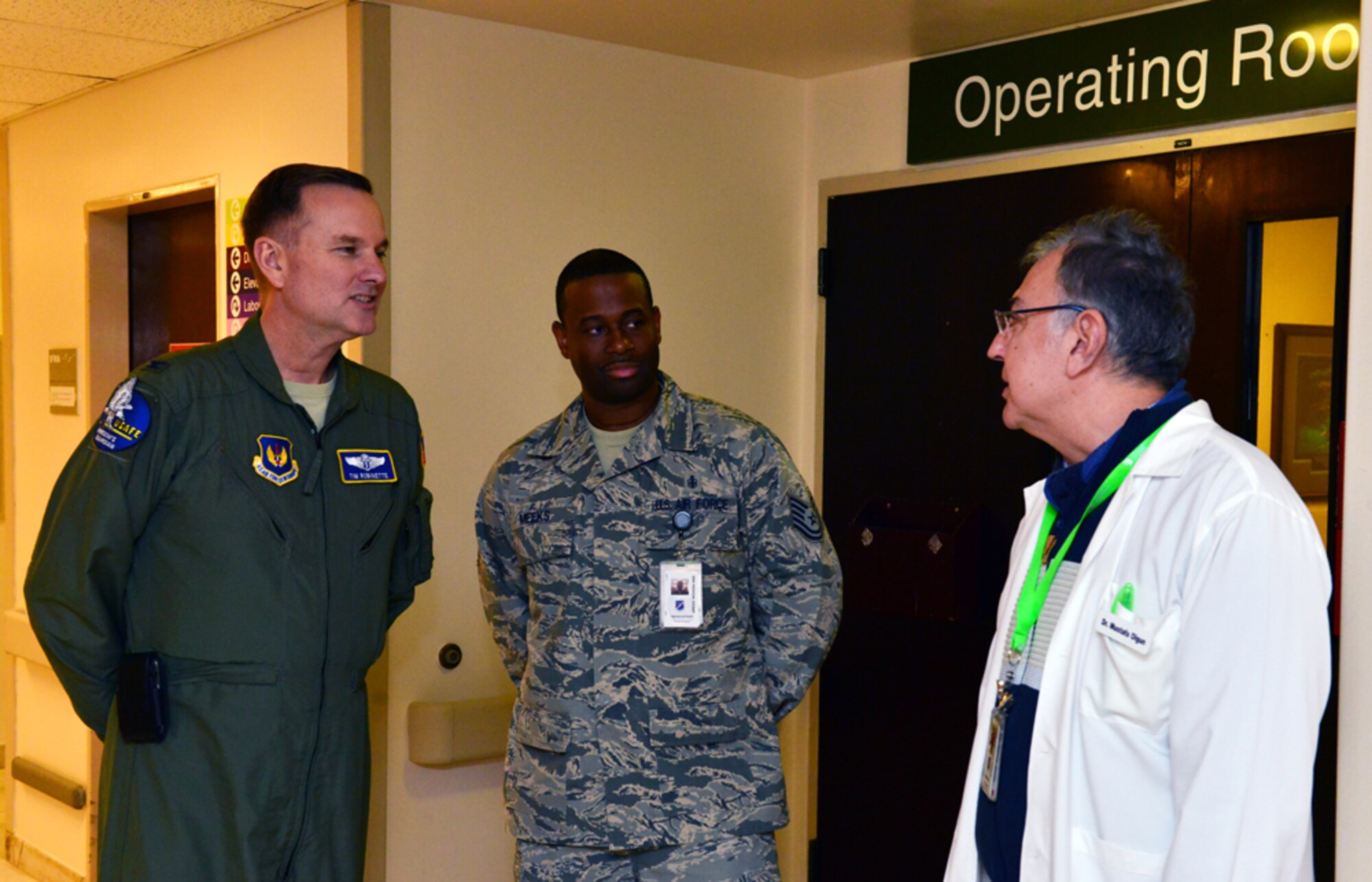 Mustafa Olgun, 39th Medical Operations Squadron ear, nose and throat physician and Tech. Sgt. Derrick Meeks, 39th MDOS surgery NCO in charge, brief Col. Timothy Robinette, U. S. Air Forces in Europe and Air Forces Africa command surgeon, during a one-day 39th Medical Group visit Jan. 22, 2015, at Incirlik Air Base, Turkey. During his visit Robinette toured key medical offices including ambulance services, bioenvironmental and education and training. (U.S. Air Force photo by Senior Airman Michael Battles/Released)