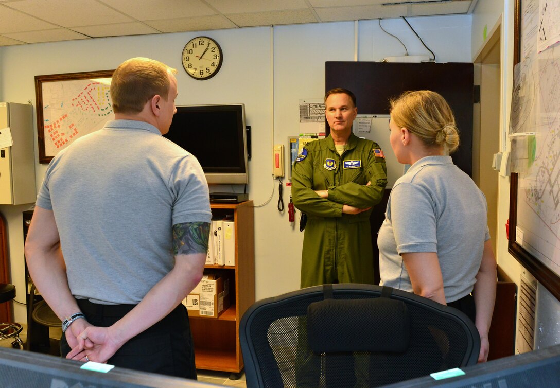 Staff Sgts. Joshua Walker and Keely Nelson, 39th Medical Operations Squadron ambulance service medical technicians, brief Col. Timothy Robinette, U. S. Air Forces in Europe and Air Forces Africa command surgeon, during a one-day 39th Medical Group visit Jan. 22, 2015, at Incirlik Air Base, Turkey. As part of his tour, Robinette received a mission brief from the 39th Medical Group leadership. (U.S. Air Force photo by Senior Airman Michael Battles/Released)