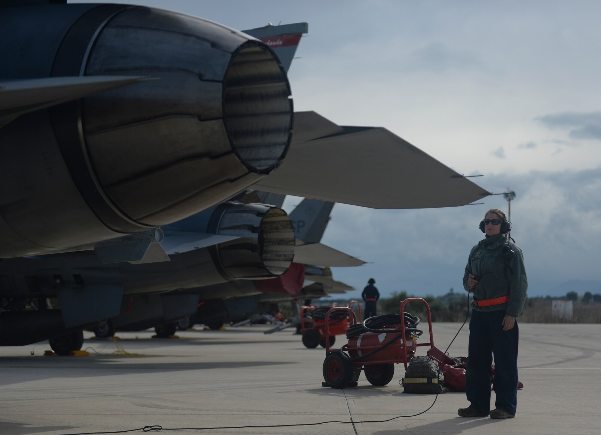U.S. Air Force Senior Airman Juli Sweger, a dedicated crew chief assigned to the 52nd Expeditionary Aircraft Maintenance Squadron, inspects an exhaust on an F-16 Fighting Falcon fighter aircraft during a flying training deployment on the flightline at Souda Bay, Greece, Jan. 27, 2015.Sweger conducted the check as part of a pre-flight inspection. (U.S. Air Force photo by Staff Sgt. Joe W. McFadden/Released)