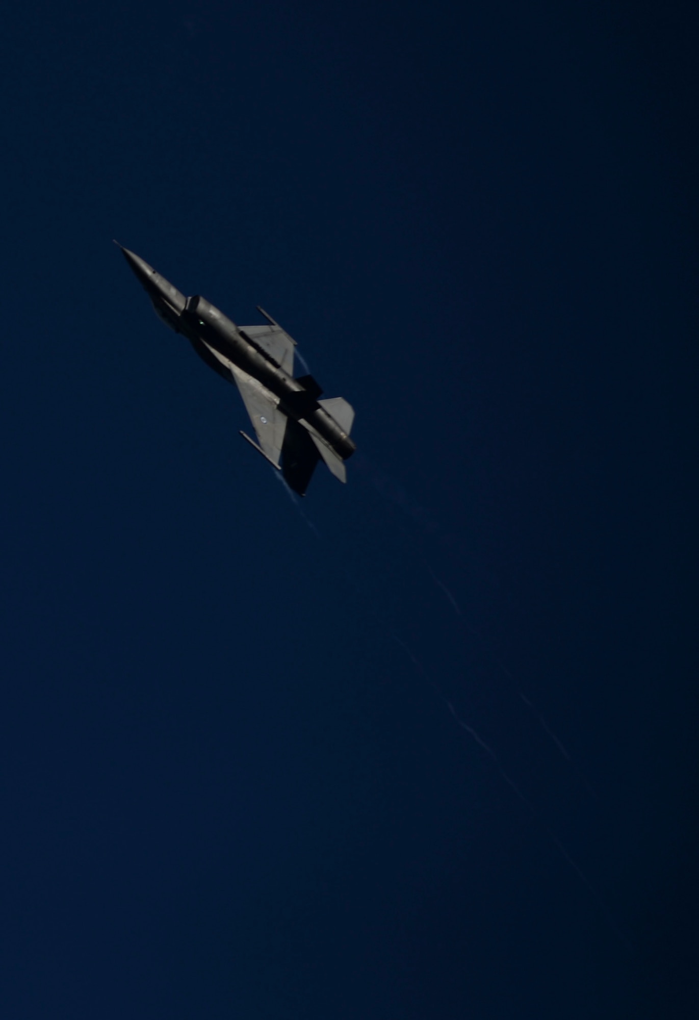 A Hellenic air force Team Zeus F-16 Fighting Falcon Demo aircraft assigned to the 340th Fighter Squadron performs aerobatic maneuvers during training over the flightline at Souda Bay, Greece, Jan. 27, 2015. The aircraft conduct training as Greek and U.S. Air Force fighter squadrons participated in a flying training deployment at Souda Bay. (U.S. Air Force photo by Staff Sgt. Joe W. McFadden//Released)