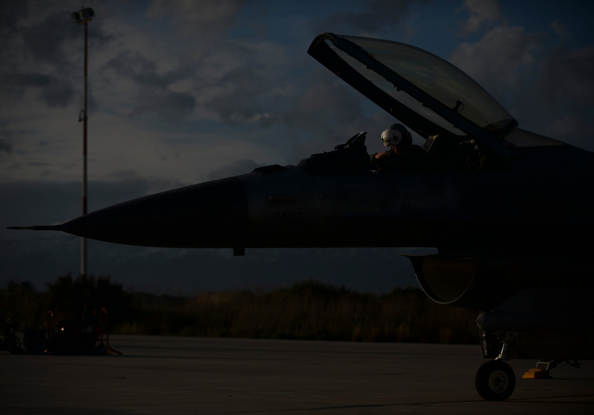 A U.S. Air Force pilot from the 480th Expeditionary Fighter Squadron prepares for flight in an F-16 Fighting Falcon fighter aircraft during a flying training deployment on the flightline at Souda Bay, Greece, Jan. 27, 2015. Eighteen F-16s from the 52nd Fighter Wing at Spangdahlem Air Base, Germany, flew to Souda Bay to participate in the training between the Greek and U.S. Air Forces. (U.S. Air Force photo by Staff Sgt. Joe W. McFadden/Released)