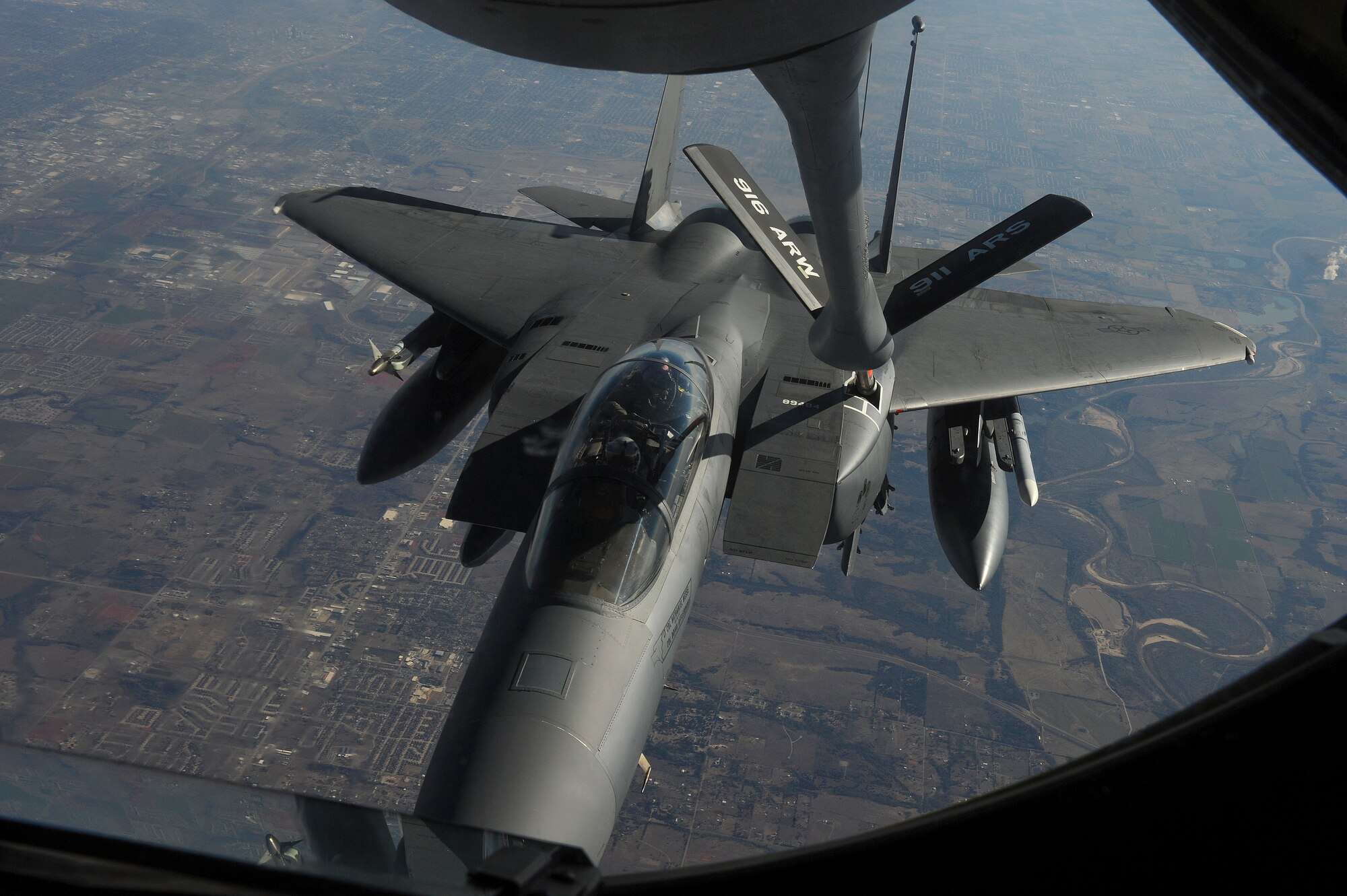 An F-15E Strike Eagle assigned to the 4th Fighter Wing on its way to Nellis Air Force Base, Nevada, in support of Red Flag 15-1, receives fuel from a KC-135R Stratotanker assigned to the 916th Air Refueling Wing, Jan. 23, 2015. Red Flag 15-1, featuring aircraft from 21 different U.S. Air Force squadrons, offers realistic combat training involving the air, space and cyber forces of the United States and its allies. (U.S. Air Force photo/Airman 1st Class Aaron J. Jenne)