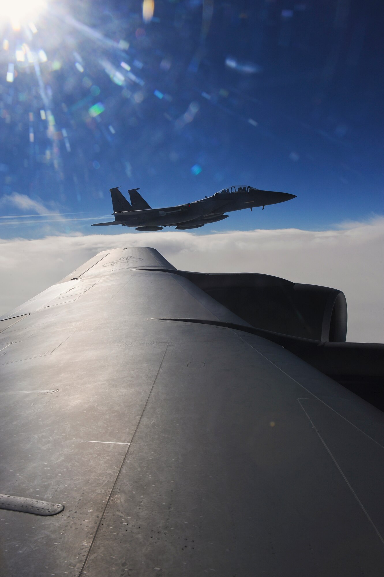 An F-15E Strike Eagle assigned to the 4th Fighter Wing on its way to Nellis Air Force Base, Nevada, in support of Red Flag 15-1, waits to receive fuel from a KC-135R Stratotanker assigned to the 916th Air Refueling Wing, Jan. 23, 2015. Eight Strike Eagles from the 4th FW are participating in the exercise, which began Jan. 26. The 4th FW’s Strike Eagles will be performing a different role for this iteration of Red Flag by providing adversary support. During the exercise, they will be simulating hostile aircraft in numerous training scenarios that build in intensity and difficulty as the weeks go on. (U.S. Air Force photo/Airman 1st Class Aaron J. Jenne)