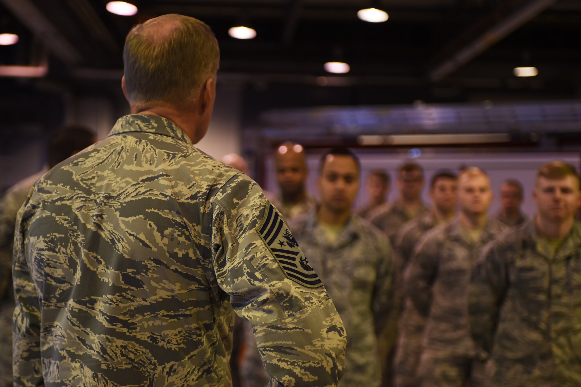 Chief Master Sgt. of the Air Force James A. Cody speaks with Airmen from the 423rd Civil Engineer Squadron during a visit to RAF Alconbury, England, Jan. 27, 2015. Throughout the visit, Airmen were able to engage with Cody on a wide-range of topics, including the new enlisted evaluations system, the future of force management and the current state of the U.S. Air Force. (U.S. Air Force photo by Staff Sgt. Jarad A. Denton/Released)