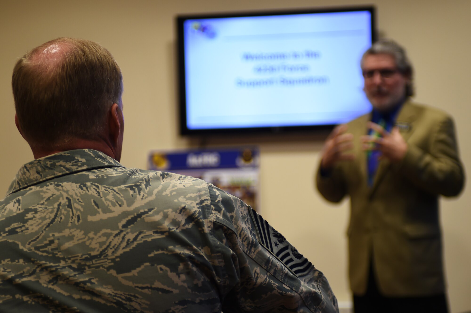 Chief Master Sgt. of the Air Force James A. Cody listens to a briefing from Thomas Badman, 423rd Force Support Squadron Airman & Family Readiness Center chief, during a visit to RAF Alconbury, England, Jan. 27, 2015. During the visit, Cody was given a guided tour of the base fitness center, which boasts several state-of-the-art systems designed to promote Airmen and family fitness. (U.S. Air Force photo by Staff Sgt. Jarad A. Denton/Released)