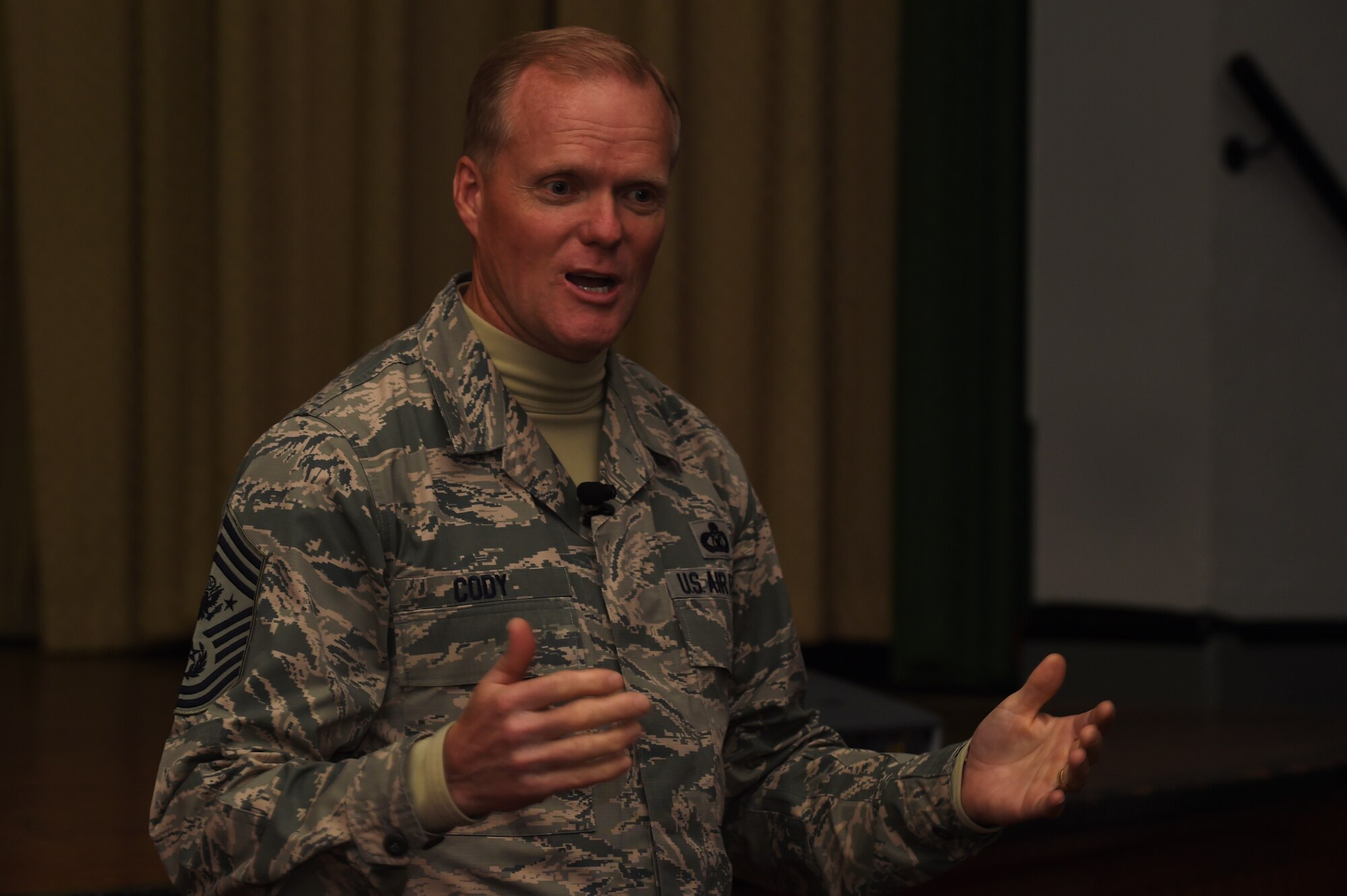 Chief Master Sgt. of the Air Force James A. Cody speaks with Airmen of the 501st Combat Support Wing during an all-call at RAF Alconbury, England, Jan. 27, 2015. During his visit, Cody spent time with junior and senior enlisted Airmen to discuss Air Force issues and answer their questions and concerns. (U.S. Air Force photo by Staff Sgt. Jarad A. Denton/Released)
