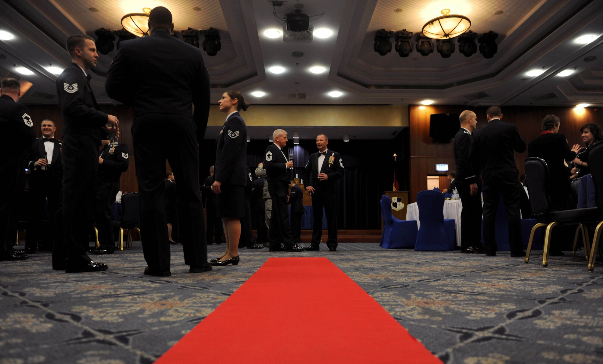 Guests socialize before the Chief Master Sergeant Recognition Ceremony in Club Eifel at Spangdahlem Air Base, Germany, Jan. 23, 2015. A total of 150 Spangdahlem community members attended the ceremony recognizing seven chief master sergeant selects. (U.S. Air Force photo by Airman 1st Class Timothy Kim/Released)