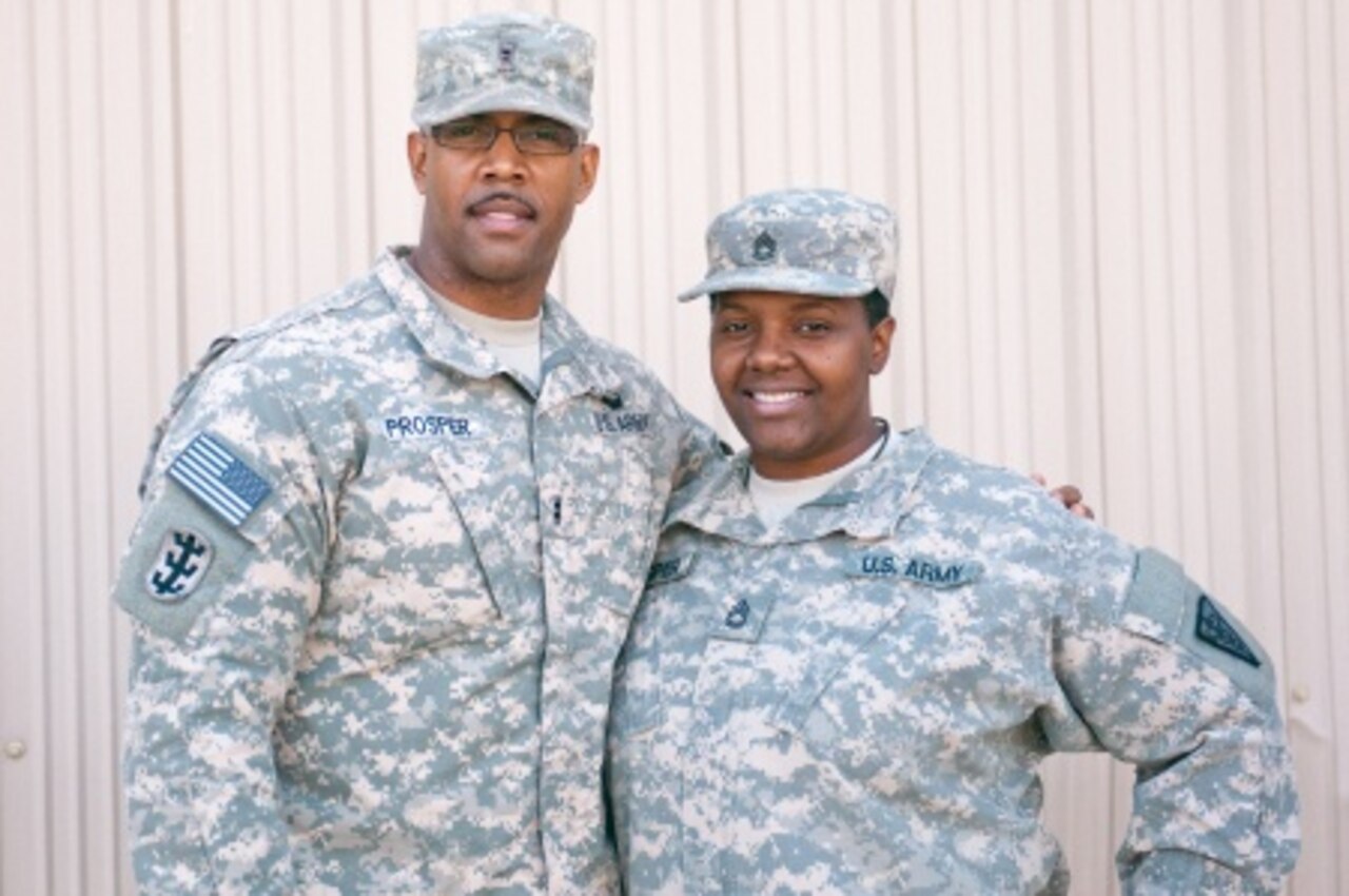 Army Chief Warrant Officer 2 Weaver Prosper, left, and Army Sgt. 1st Class Suzanne Prosper pose for a photograph at Camp Arifjan, Kuwait, Jan. 27, 2015. U.S. Army photo by Staff Sgt. Gene Arnold