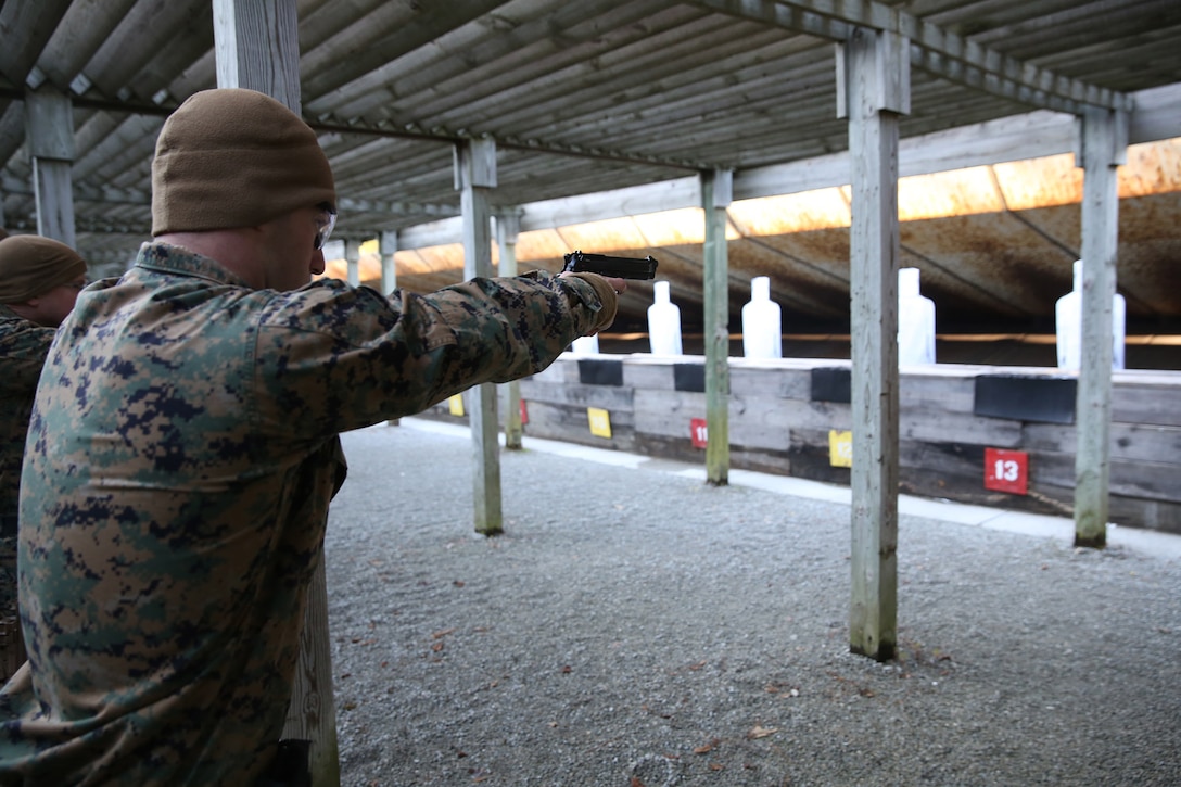 U.S. Marine Corps Cpl. Edward Zawilla, 22nd Marine Expeditionary Unit intelligence analyst and native of Elk Grove Village, Ill., fires an M9 service pistol during a pistol range at Marine Corps Base Camp Lejeune, N.C., Jan. 28, 2015. (U.S. Marine Corps photo by Cpl. Caleb McDonald/Released)