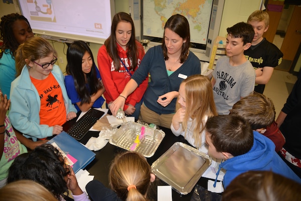 Students watch a Flood Wall Demonstration.
